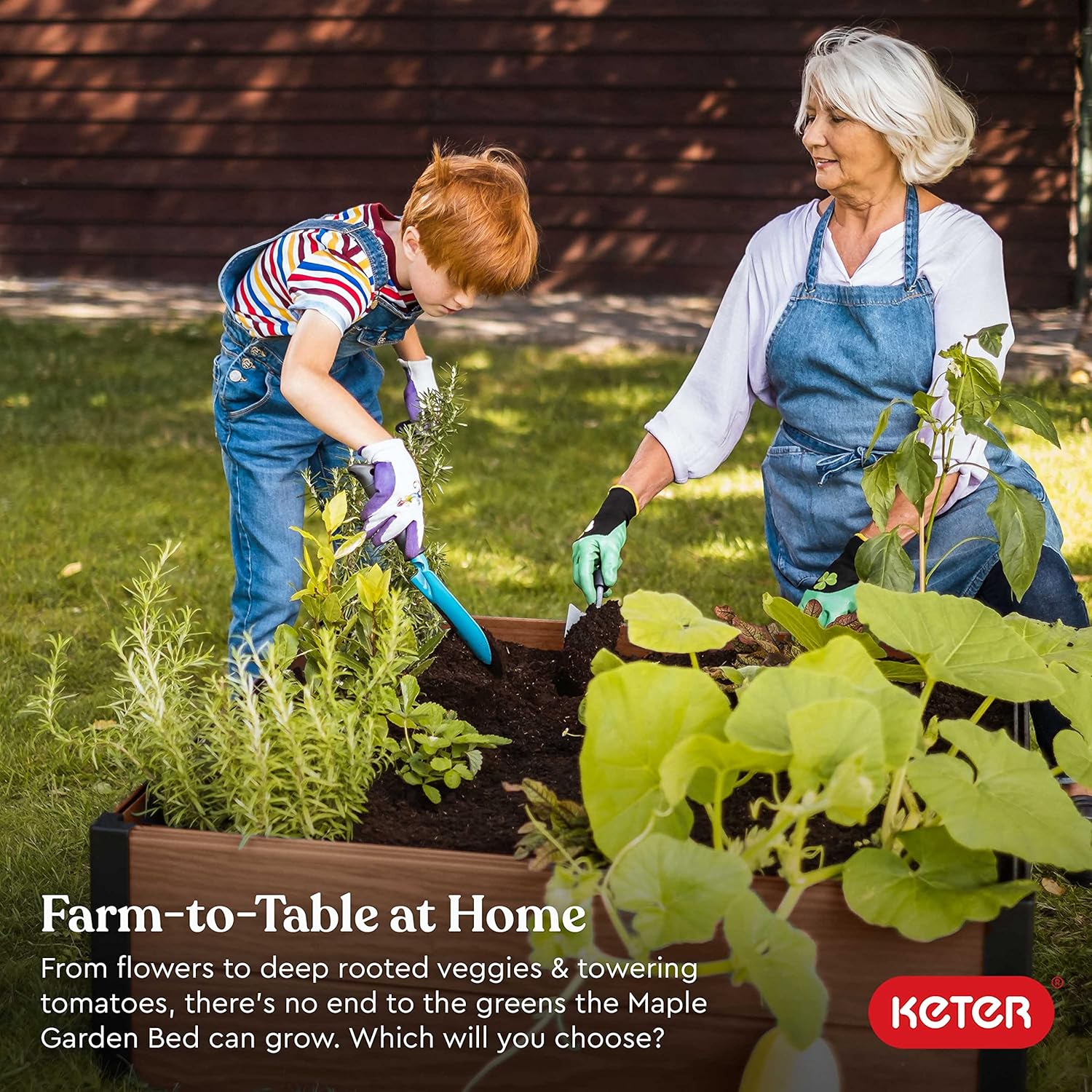 The assembled Keter Maple Raised Garden Bed, filled with various plants, showcasing its wood-look texture and sturdy black corner posts.