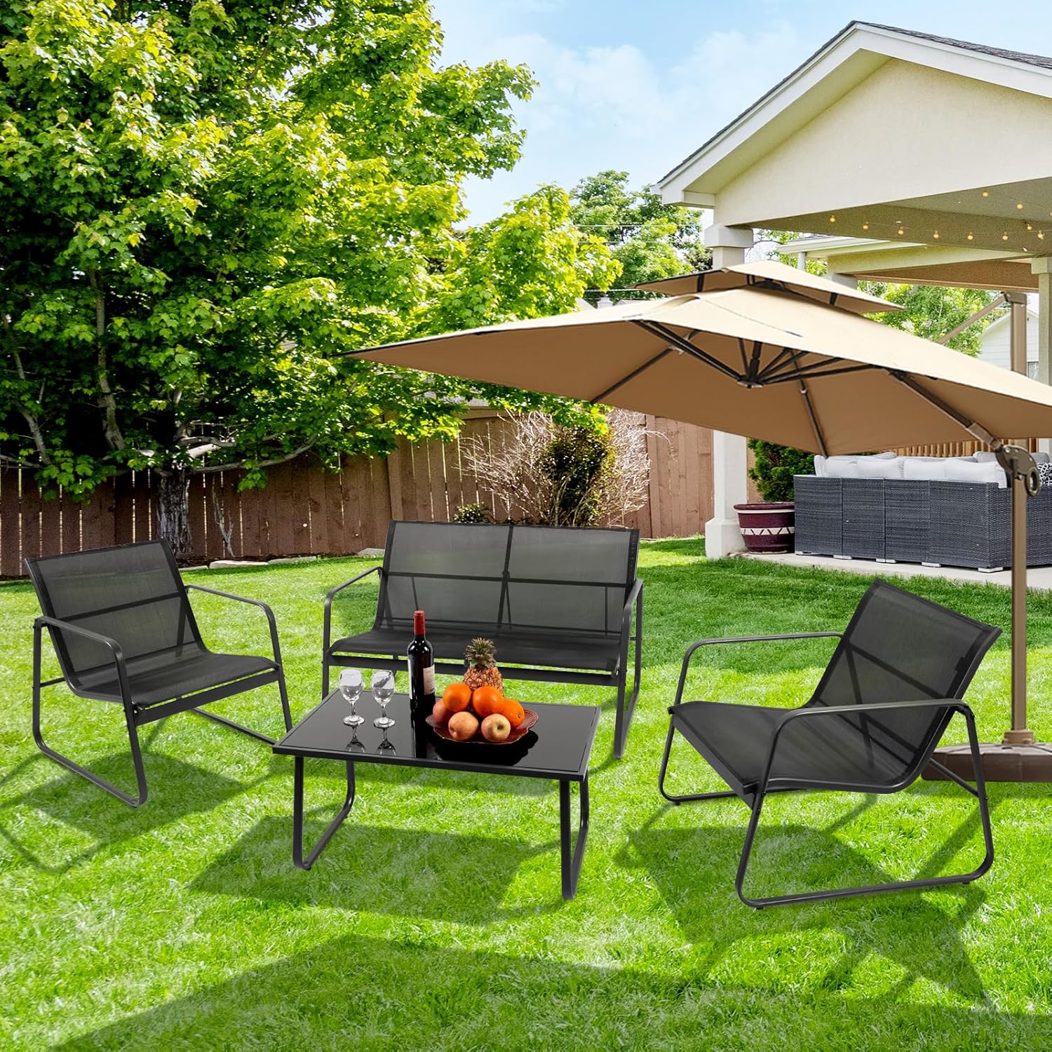 PAIQIAN 4-Piece Patio Furniture Set placed in a lush green garden with an umbrella.