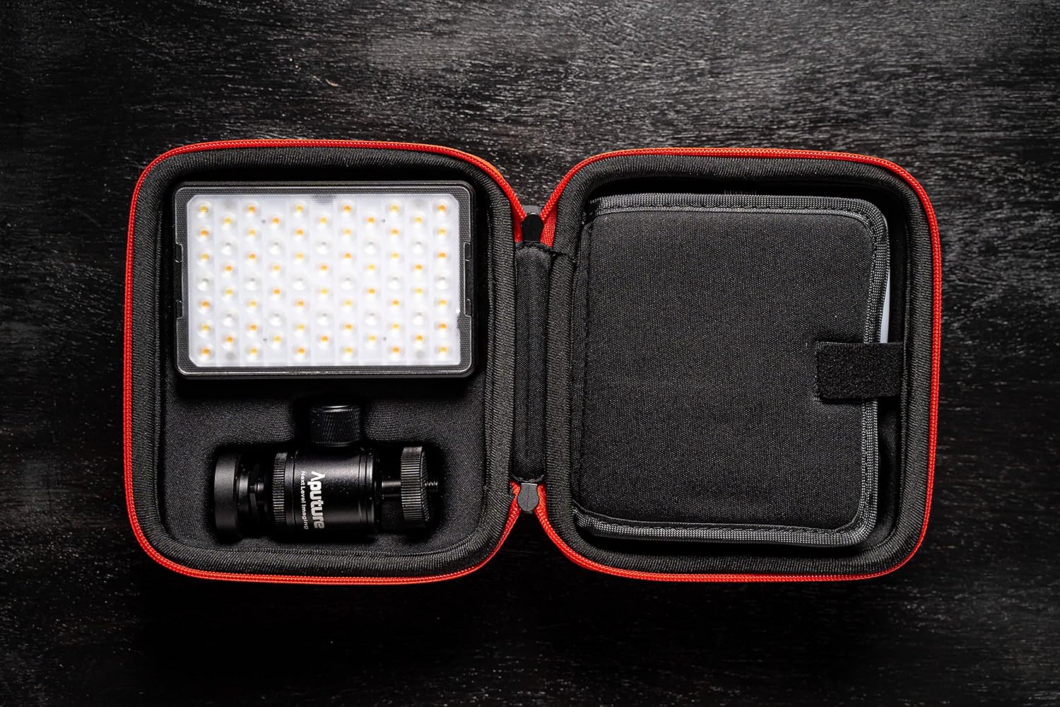 Aputure MC PRO light and accessories neatly packed in its carrying case
