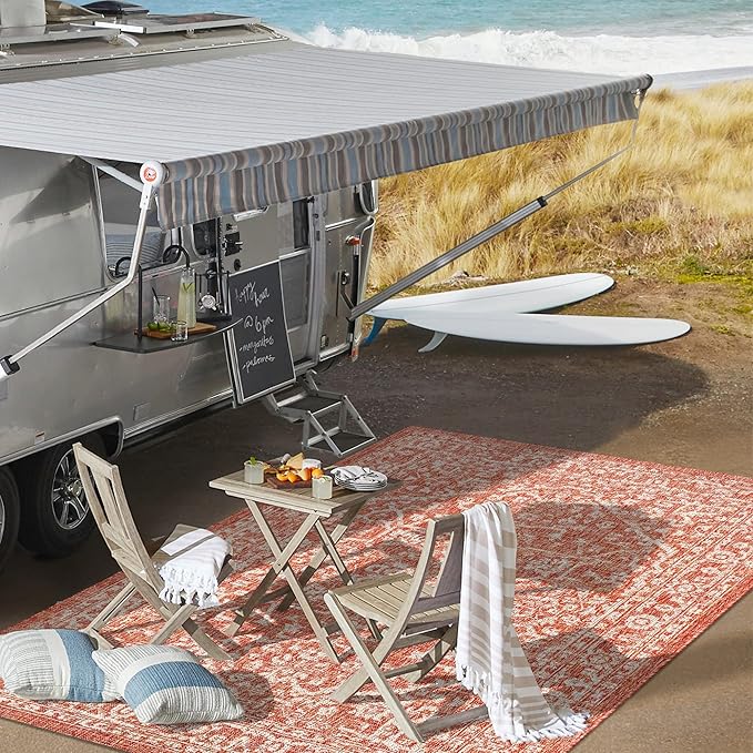 Made of durable materials, this rug is designed to withstand the elements when used outdoors, making it a great option for outdoor entertaining areas or high-traffic indoor spaces. The textured surface of the rug adds depth and interest to the design while also providing added traction and stability. Easy to clean and maintain, this area rug is a practical and stylish addition to any home decor. Description by ChatGPT.