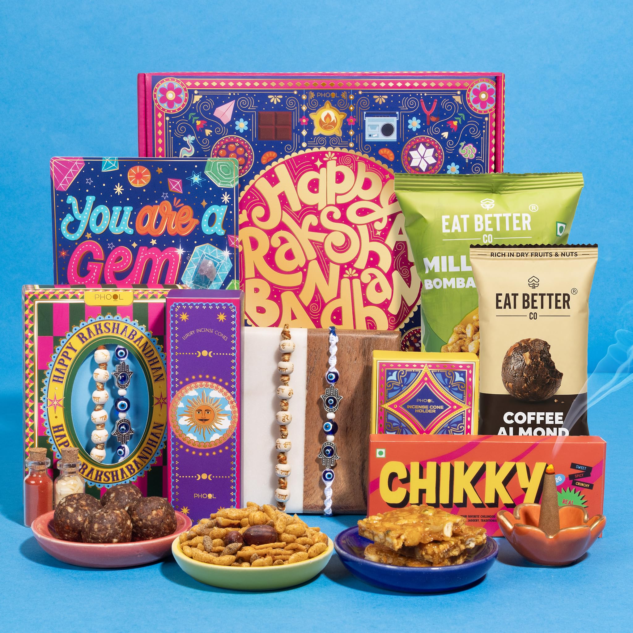 Phool 8 - Item - Raksha Bandhan Gift Hamper for Brother | Set of 2 Rakhis - Hare Rama Hare Krishna & Evil Eye Hamsa | Indian Rose Incense Bhel, Laddoo, Chikki & Rakhi Card | Rakhi gift box for brother-image-26