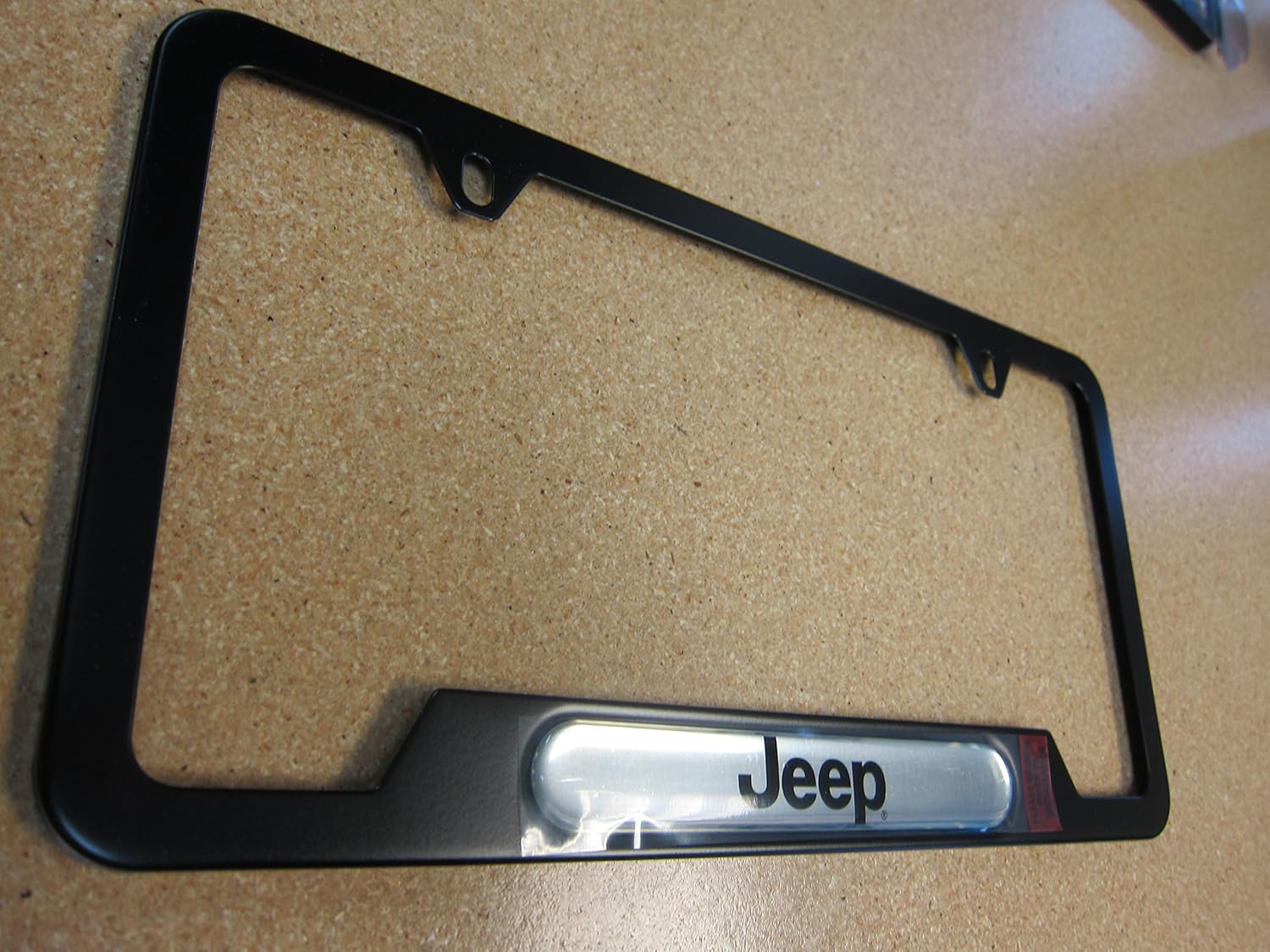 Mopar 82213252AB License Plate Frame License Plate Frame, Satin Black, two top holes, Jeep brand logo. Fits all Jeep vehicles
