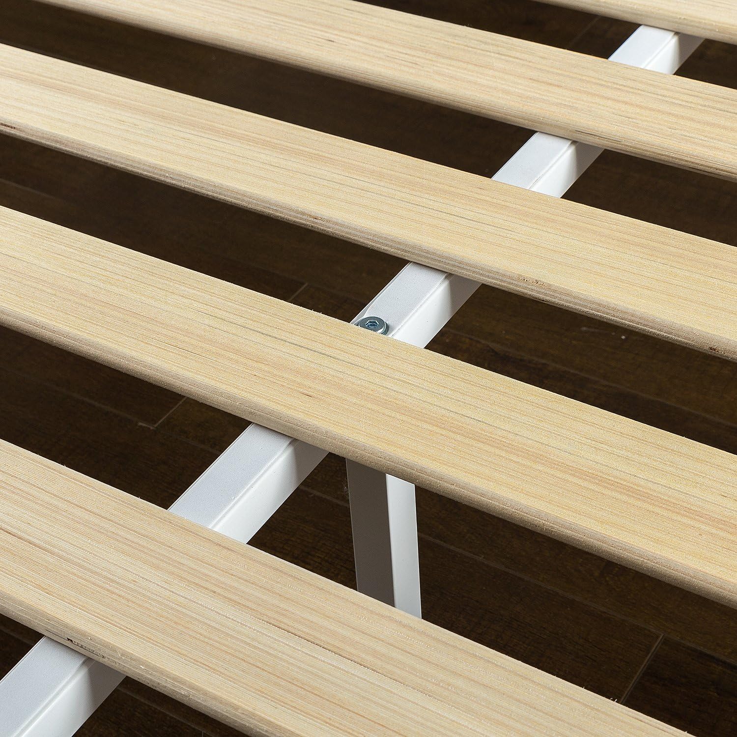 Close-up view of the wooden slats and metal support structure of the Zinus bed frame.