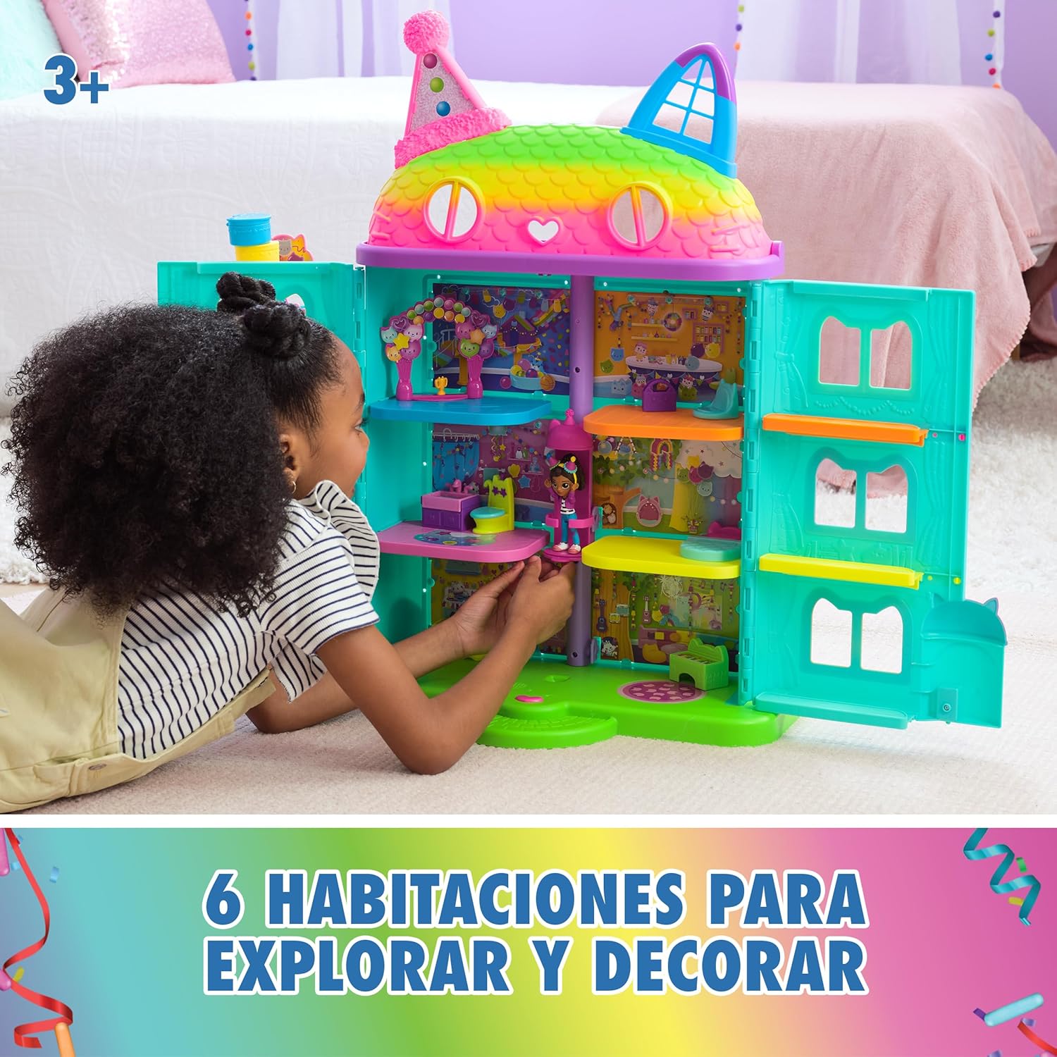 Child playing with the open Gabby's Dollhouse, showing 6 rooms to explore and decorate
