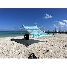 Neso Portable Beach Tent Sun Shelter with Sand Anchor - Lightweight Beach Shade Canopy - Easy Setup for Family Outings - Patented Reinforced Corners - UPF 50+ Sun Protection - 7 x 7ft - Swells