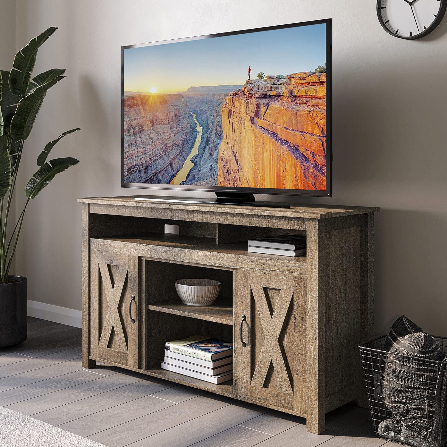 BELLEZE Modern 48-Inch Barn Door Wood TV Stand in a living room setting with a television