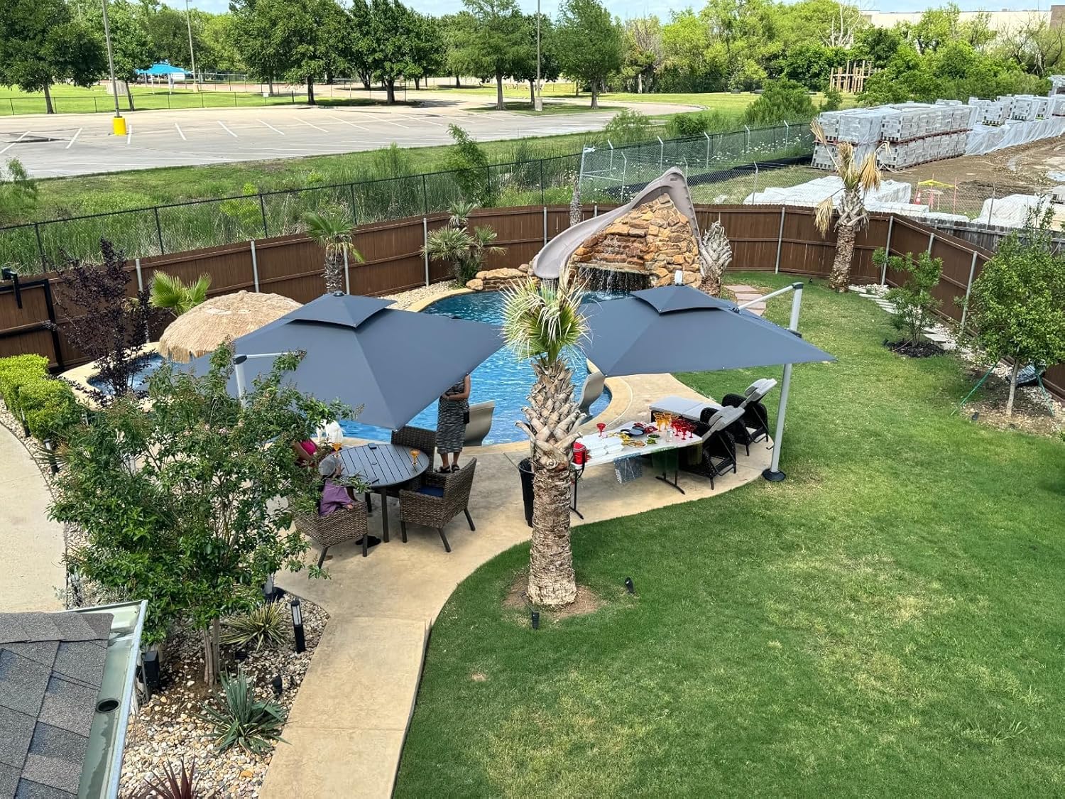 Two large cardboard boxes containing the PURPLE LEAF patio umbrella components