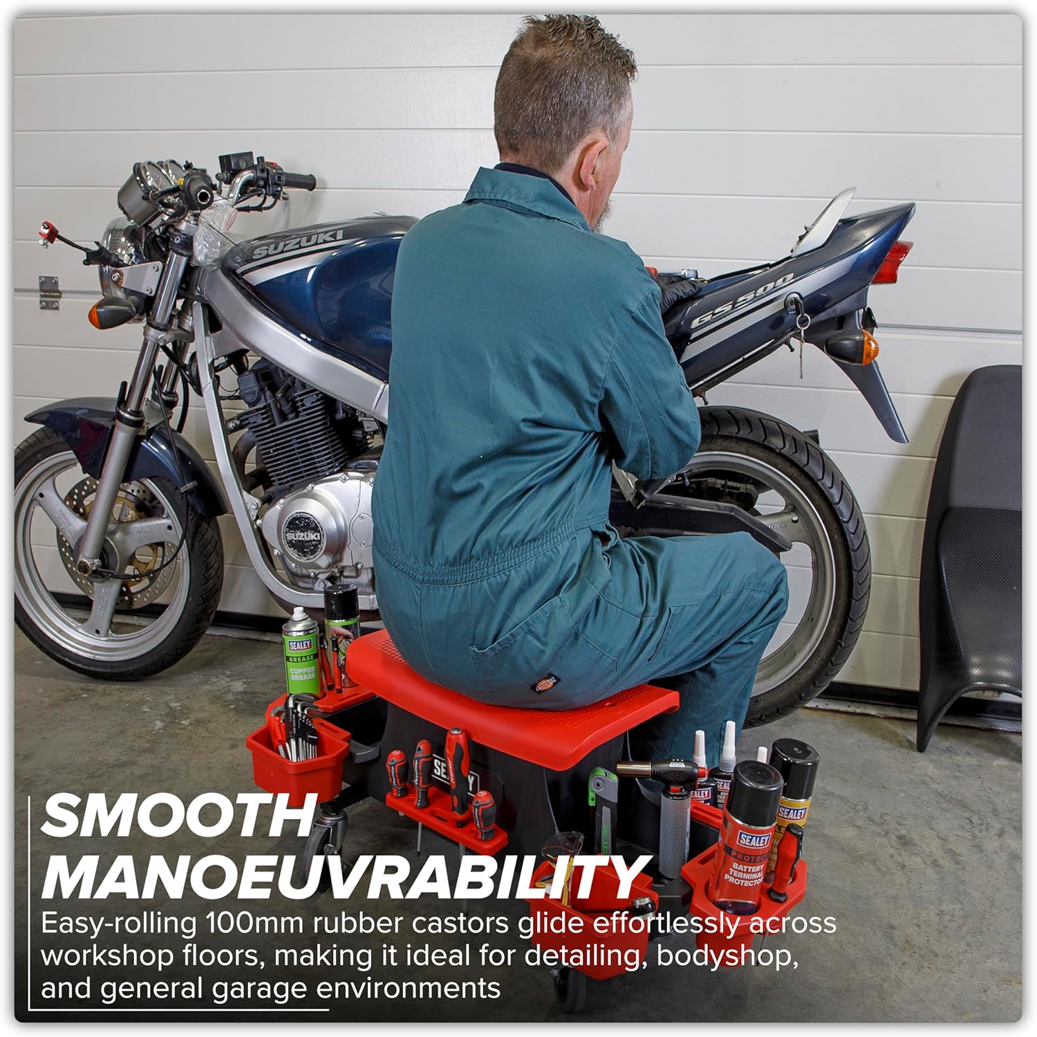 Mechanic using Sealey SCR91 Utility Seat in a workshop, demonstrating smooth maneuverability