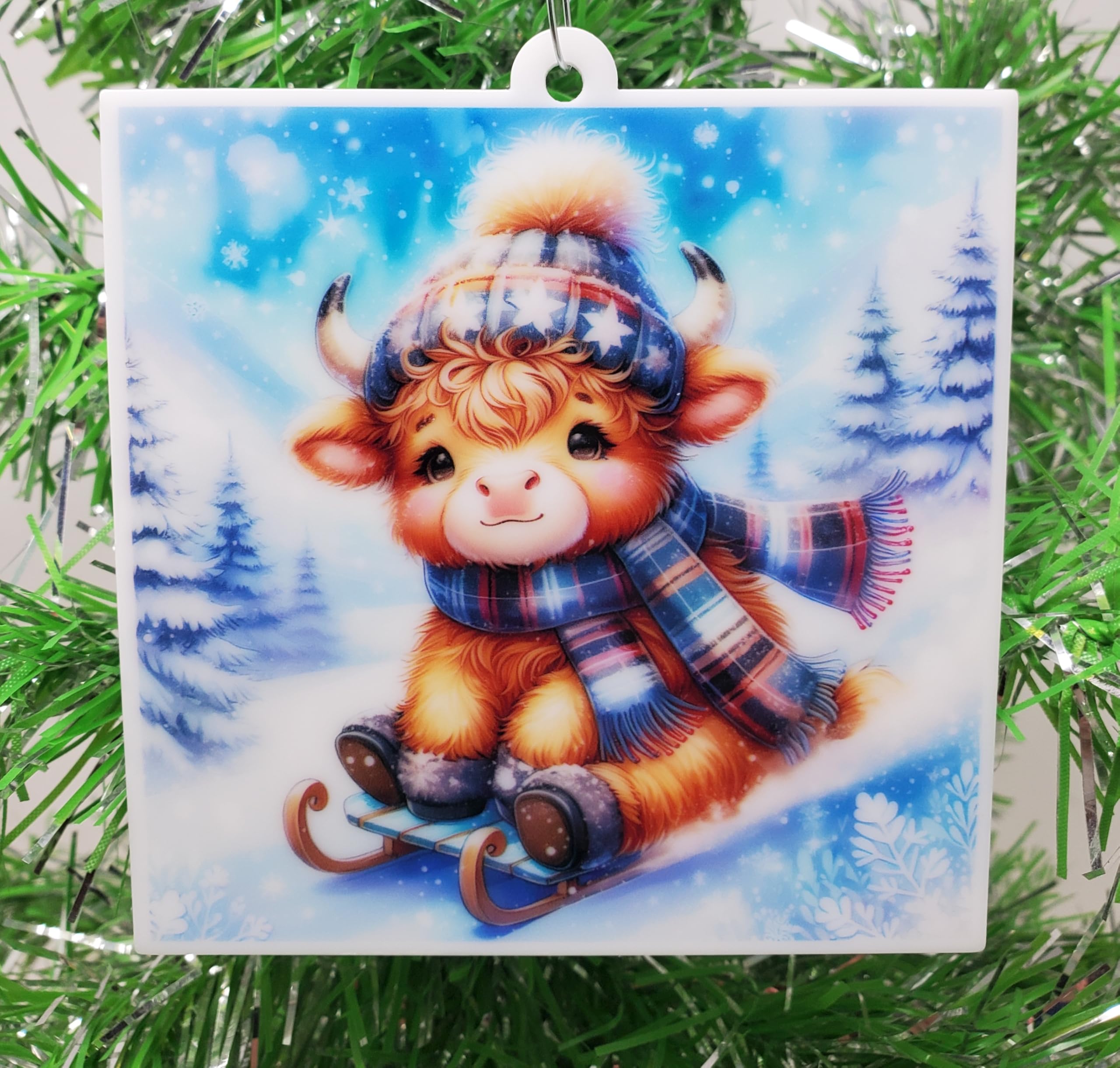 Bébé vache des Highlands décoration Noël traîneau figurine hiver