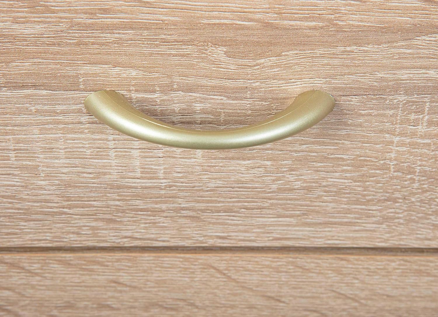 Close-up of a single silver-colored drawer handle