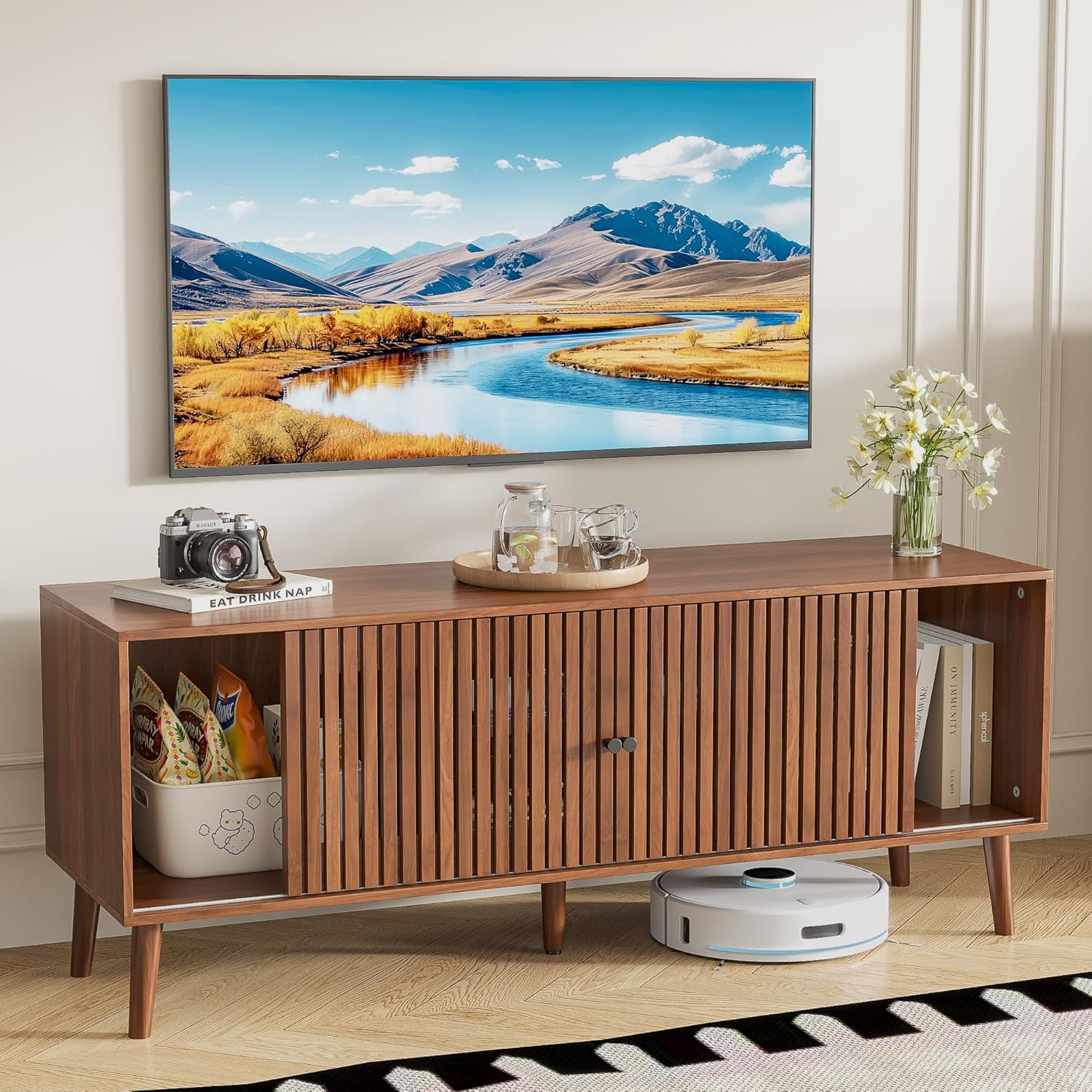 Oubayajia TV Stand with one sliding door open to reveal a storage basket with snacks and another compartment with books.