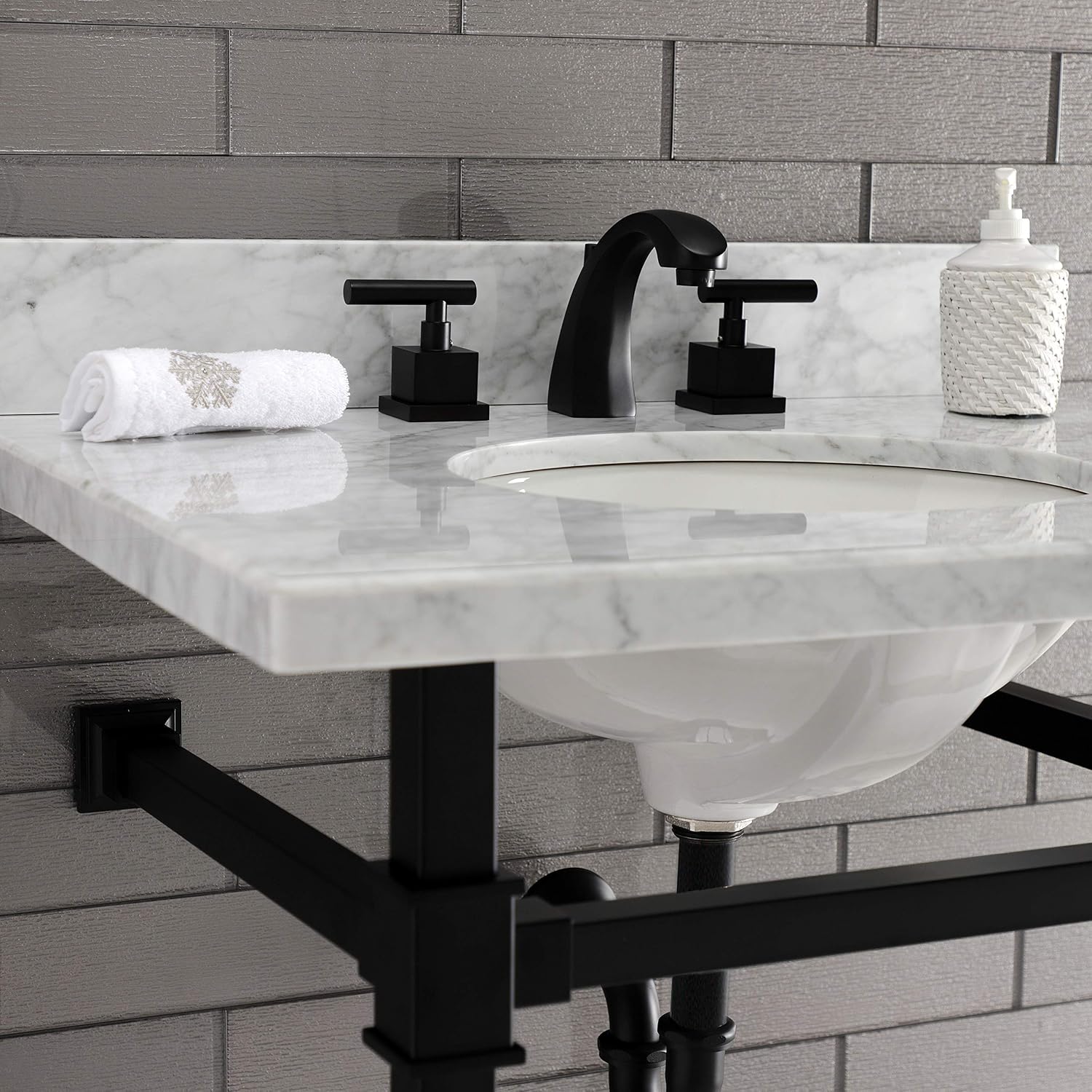 Close-up view of Kingston Brass Monarch Console Sink with faucet and soap dispenser