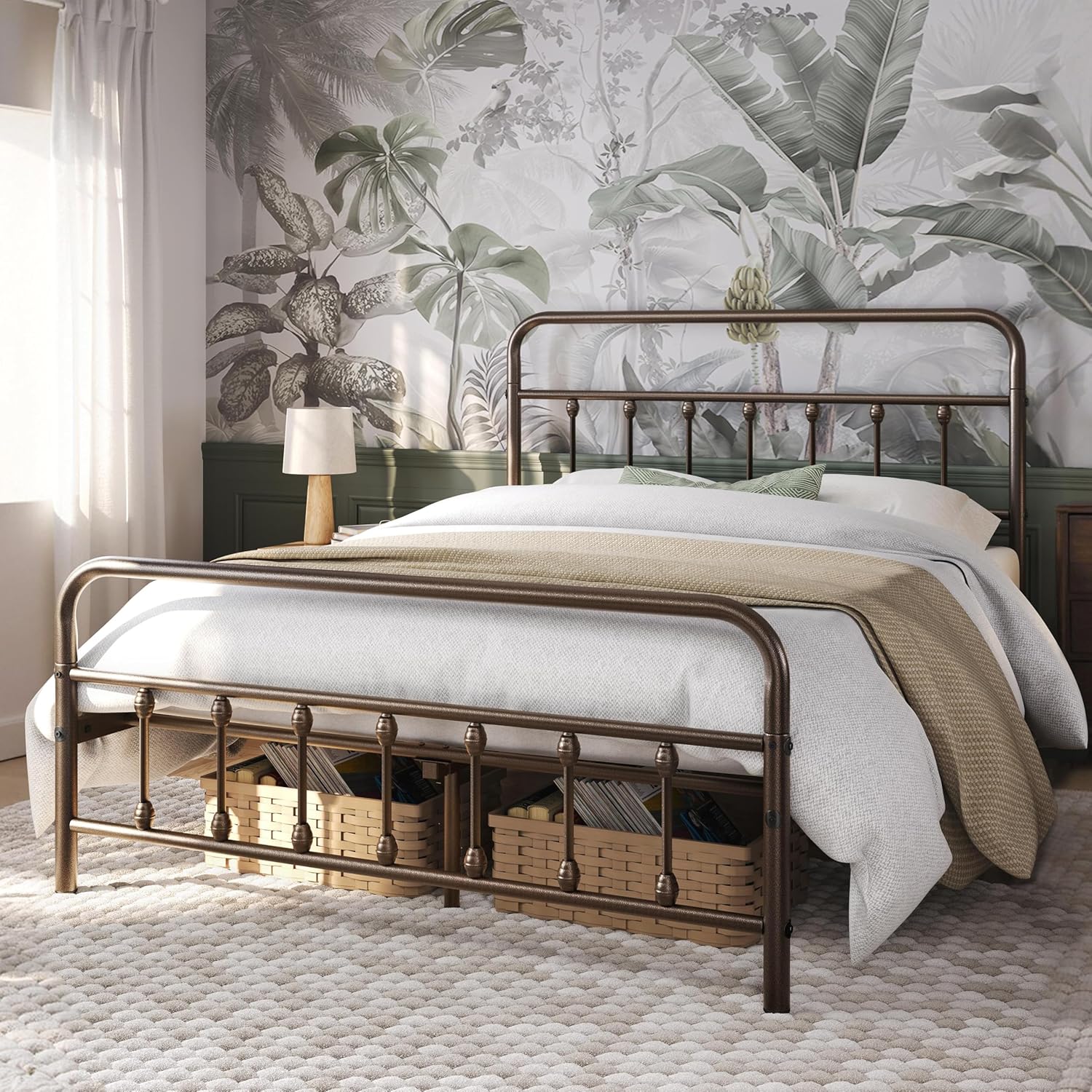 A full-size bronze metal bed frame with a mattress and bedding, showing ample space underneath for storage baskets.