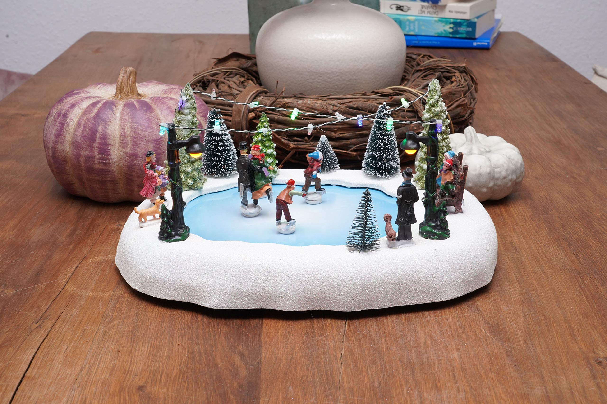 Spetebo Scène de Noël LED - Patinoire avec figurines mobiles - Décoration de table - Décoration de Noël éclairée