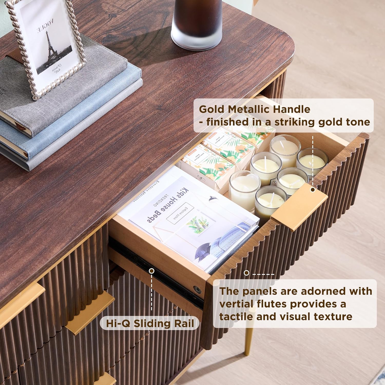 Close-up of an open drawer showing the gold handle and sliding rail