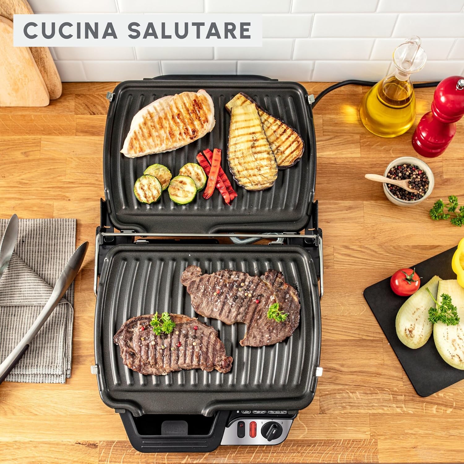 Moulinex UltraCompact Comfort Grill with chicken and steak cooking on the plates, emphasizing healthy cooking.