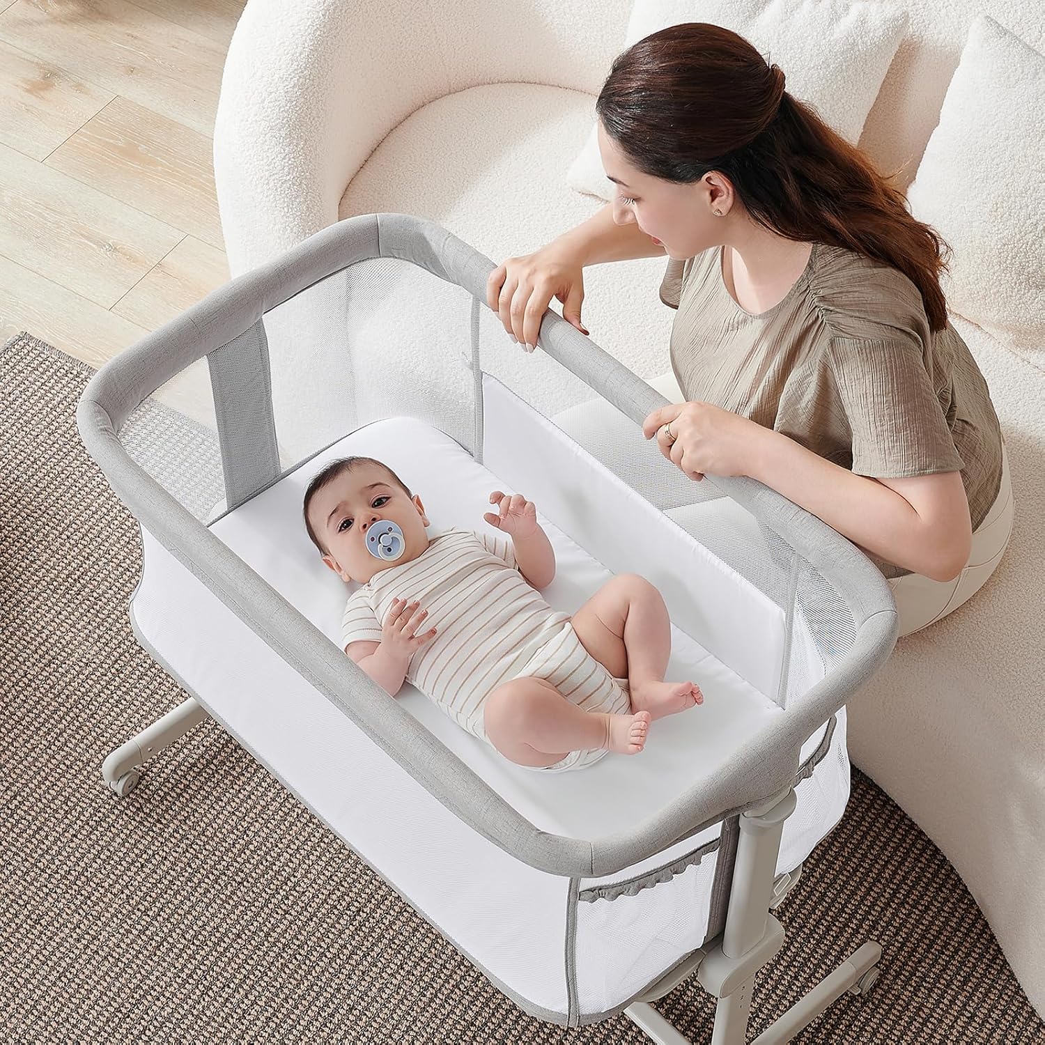 Assembled besrey Baby Bassinet next to a bed
