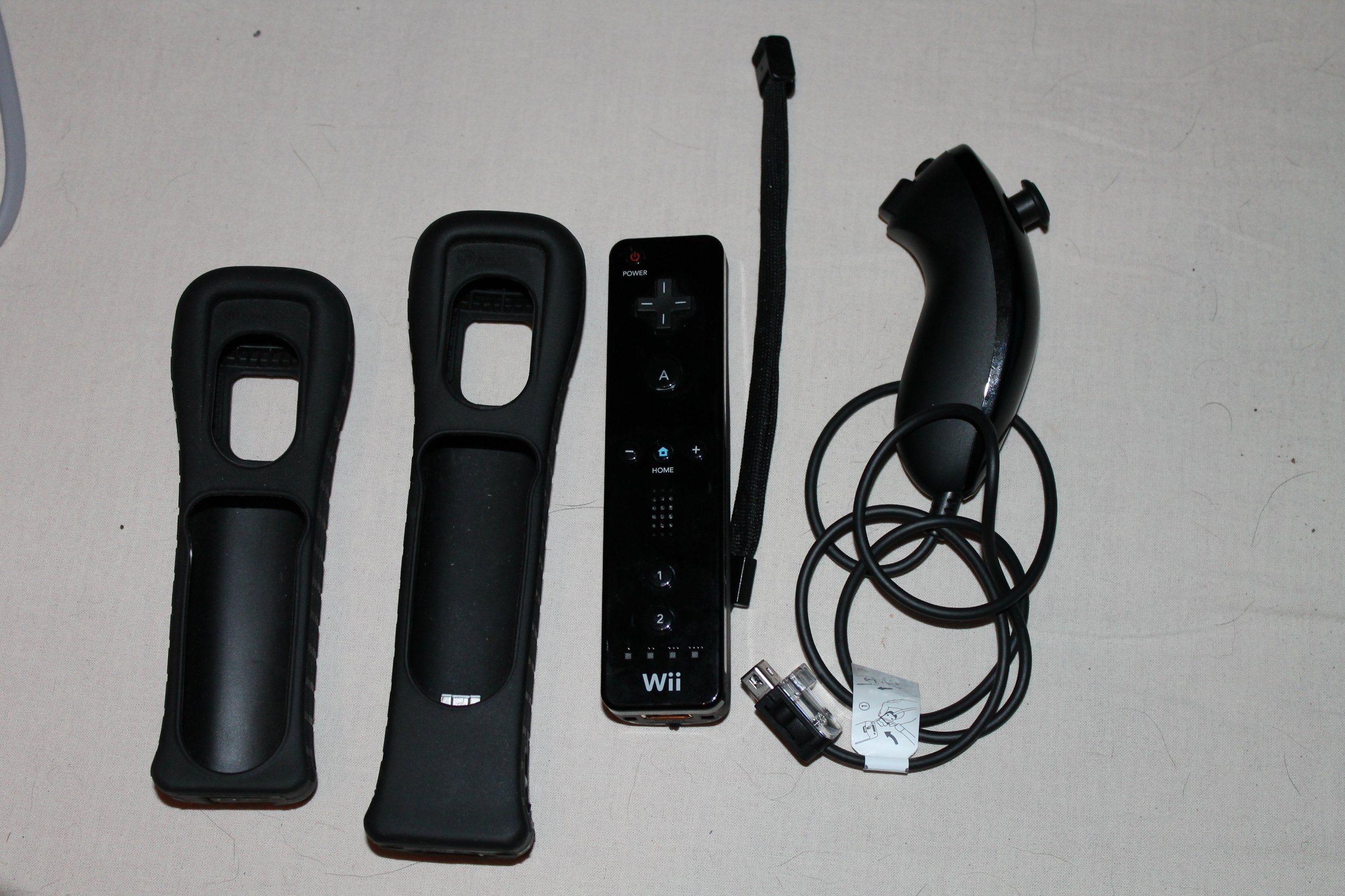 Console Wii noire + accessoires (inclus Wii Sports + Wii Sports Resort)