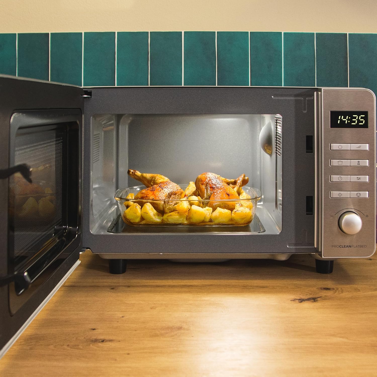 Microwave interior with roasted chicken and potatoes