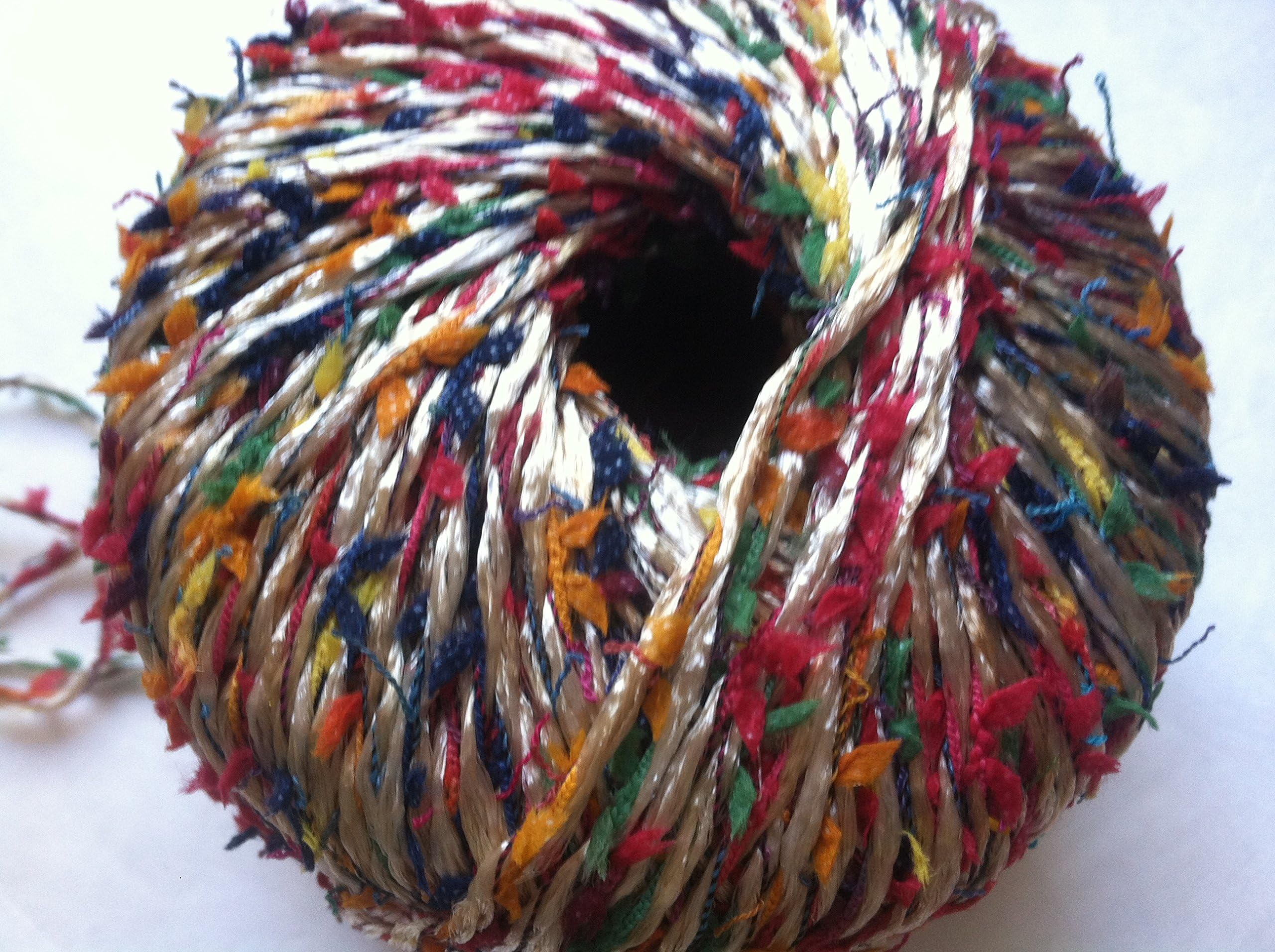Muench Oceana Yarn #4807 Sandstone with Red, Green, Orange, Yellow, Blue, Black Bows - 50 Gram