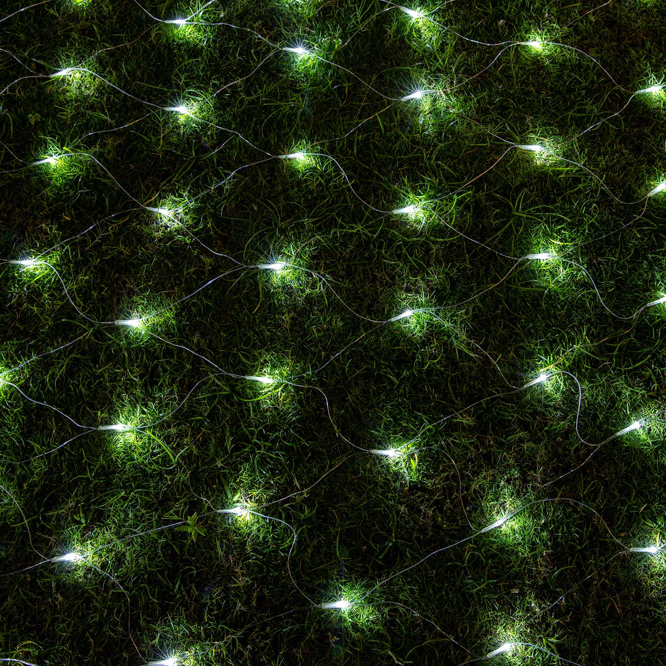 AWQ 200 LED White Net Mesh String Lights illuminating a garden bench and lawn.