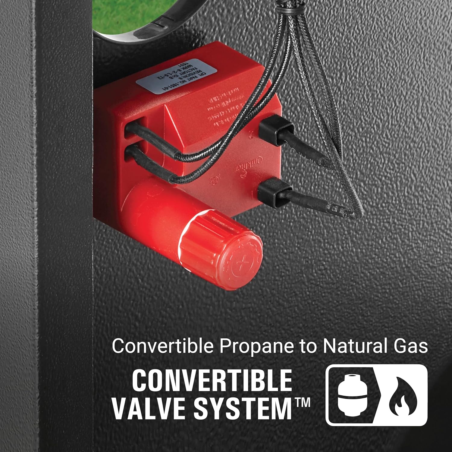 Close-up of the Instastart push-button igniter on the Coleman Revolution grill control panel.