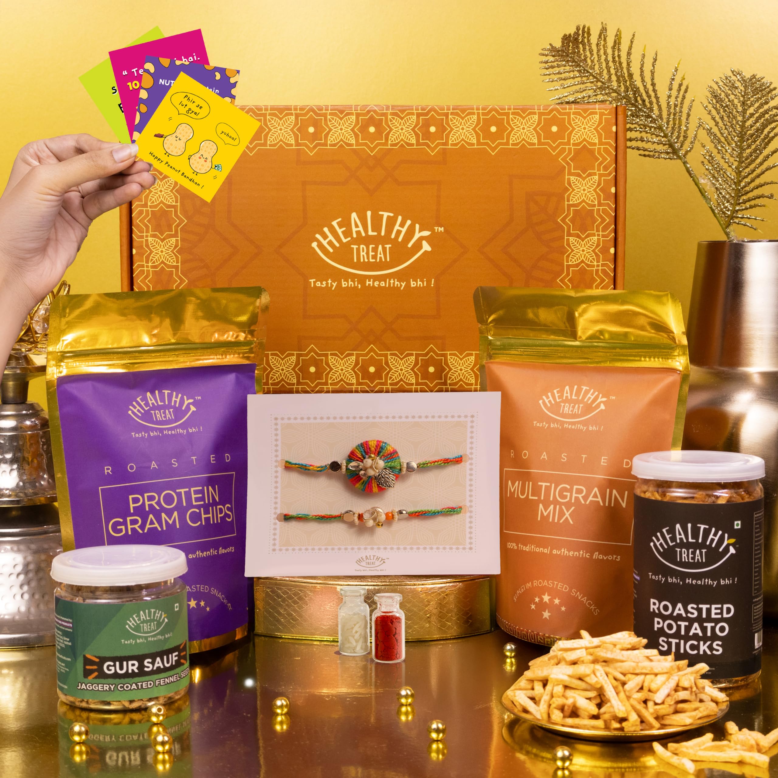 Healthy Treat Eternal Rakhi Combo for Brother with Snacks, 9 Items | Rakhi Pair, Roli Chawal, Gur Saunf, Protein Gram Chips, Potato Sticks, Multigrain Mix, Stickers, Raksha Bandhan Gift