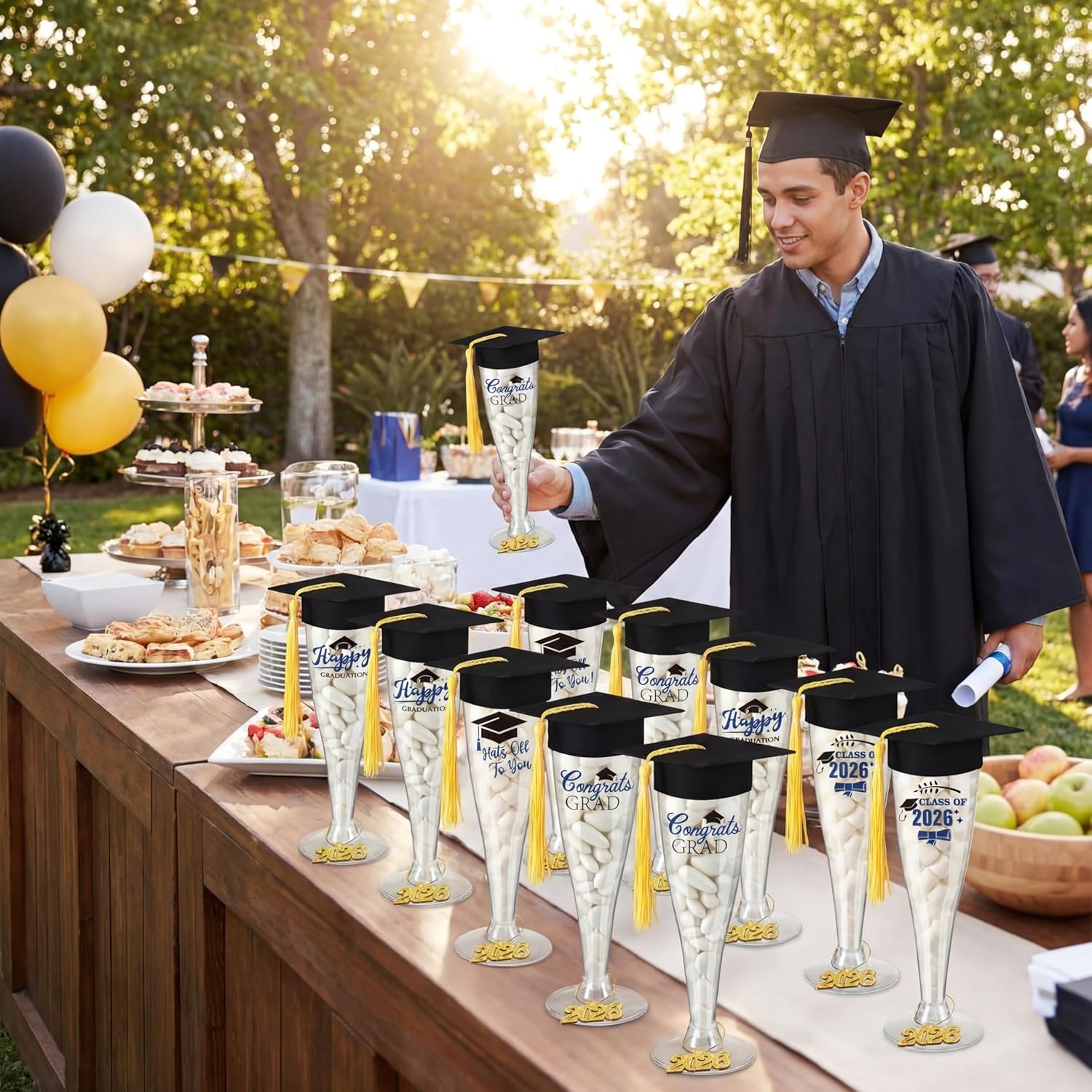 Sawysine 24 Set Graduation Candy Champagne Flutes Table Centerpiece Decoration 6.29'' 2026 Graduation Party Favor 4.5 oz Plastic Grad Cap Jar with Tassel 2026 Pendant Sticker(Black Hats)