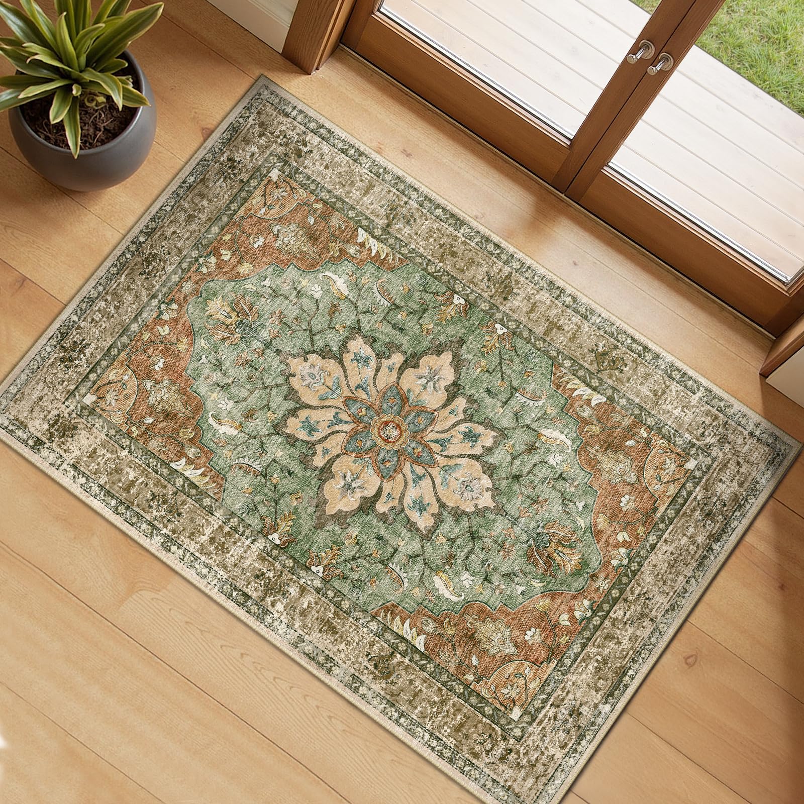 RELEANY floral area rug in brick red, brown, and green