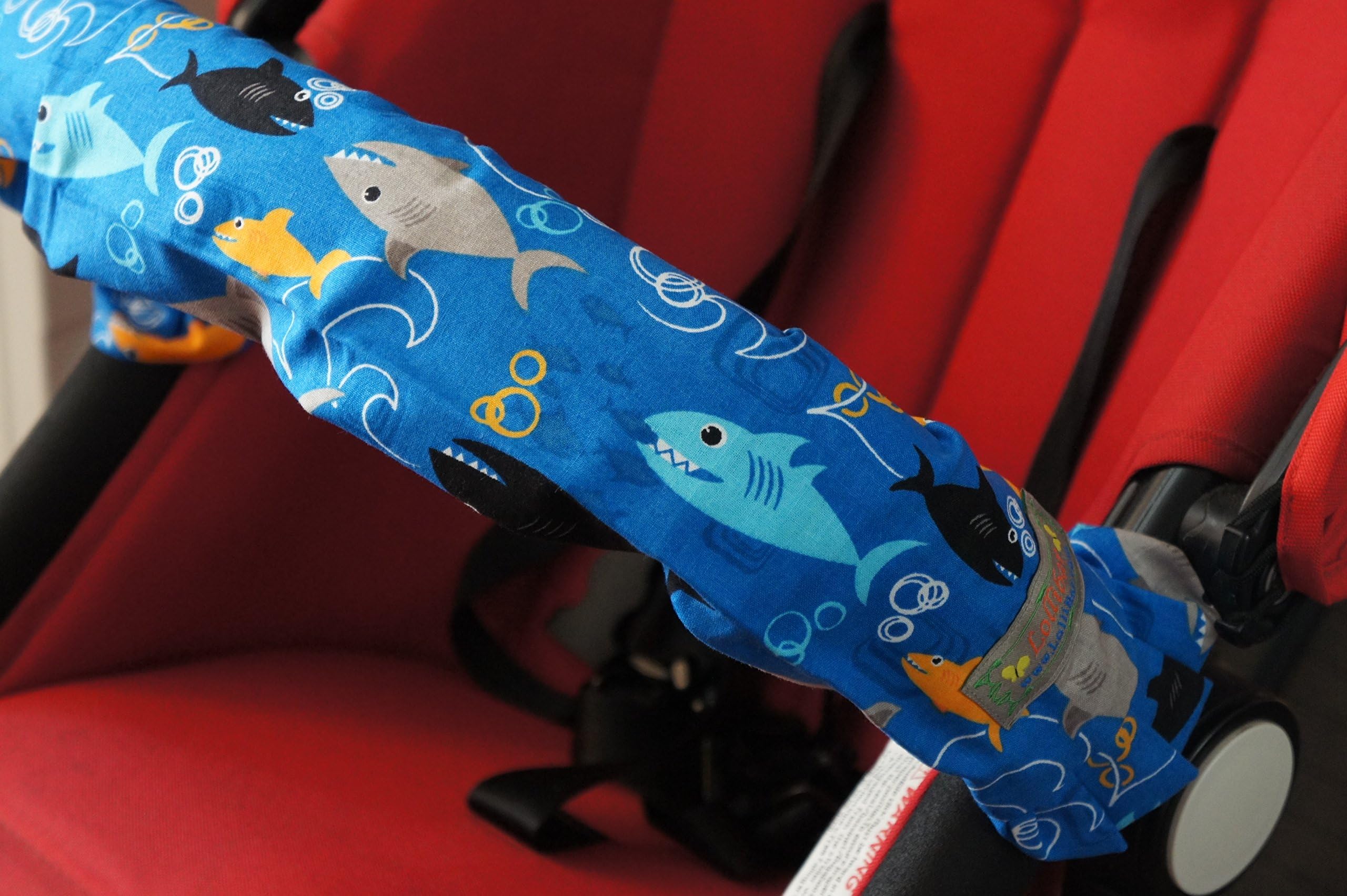 Lollibar Stroller Safety Handlebar Cover in Pattern"SHARK ATTACK" Blue Background with Multi-Colored Sharks