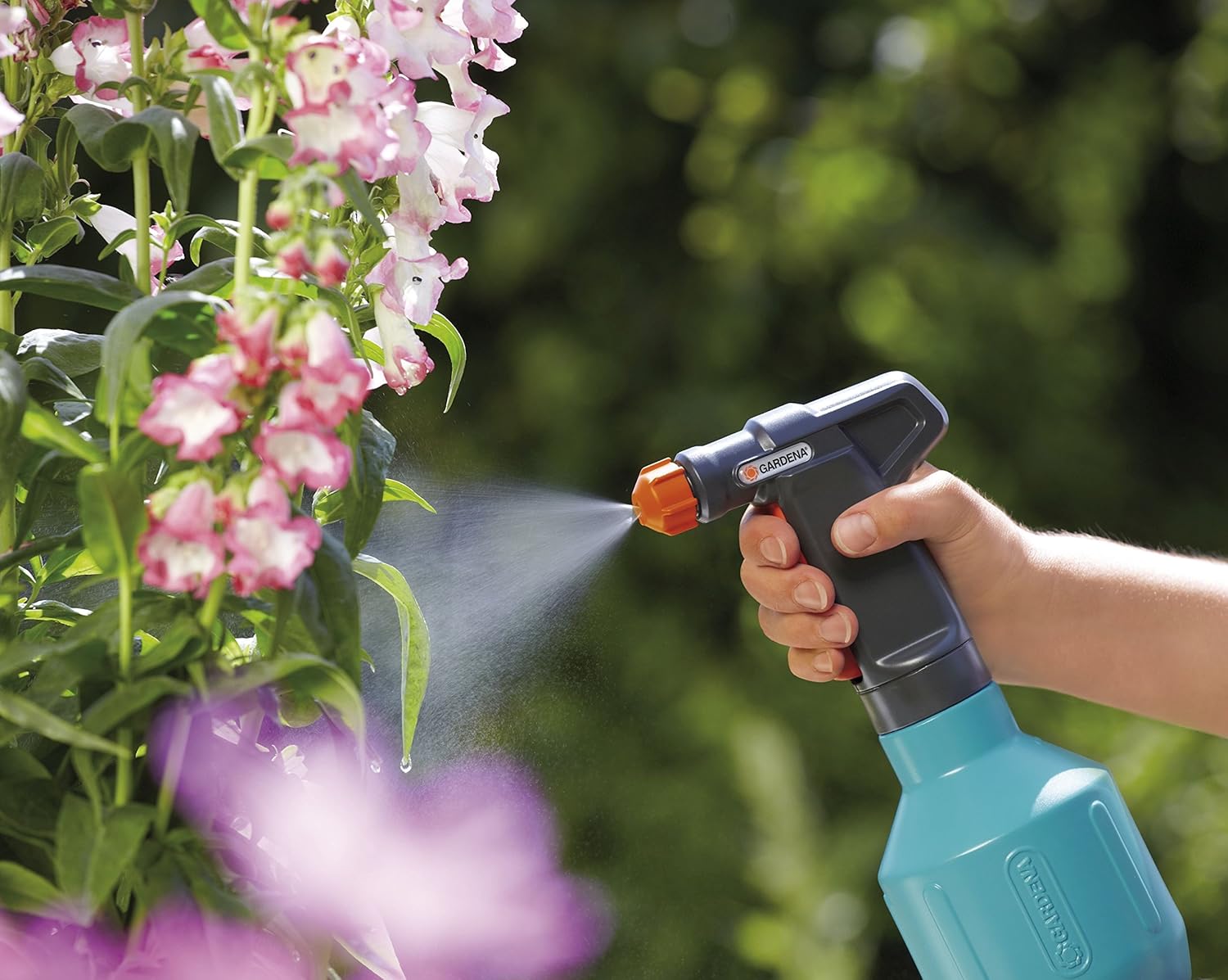 Gardena 0.5 L Comfort Trigger Sprayer in use, misting a plant