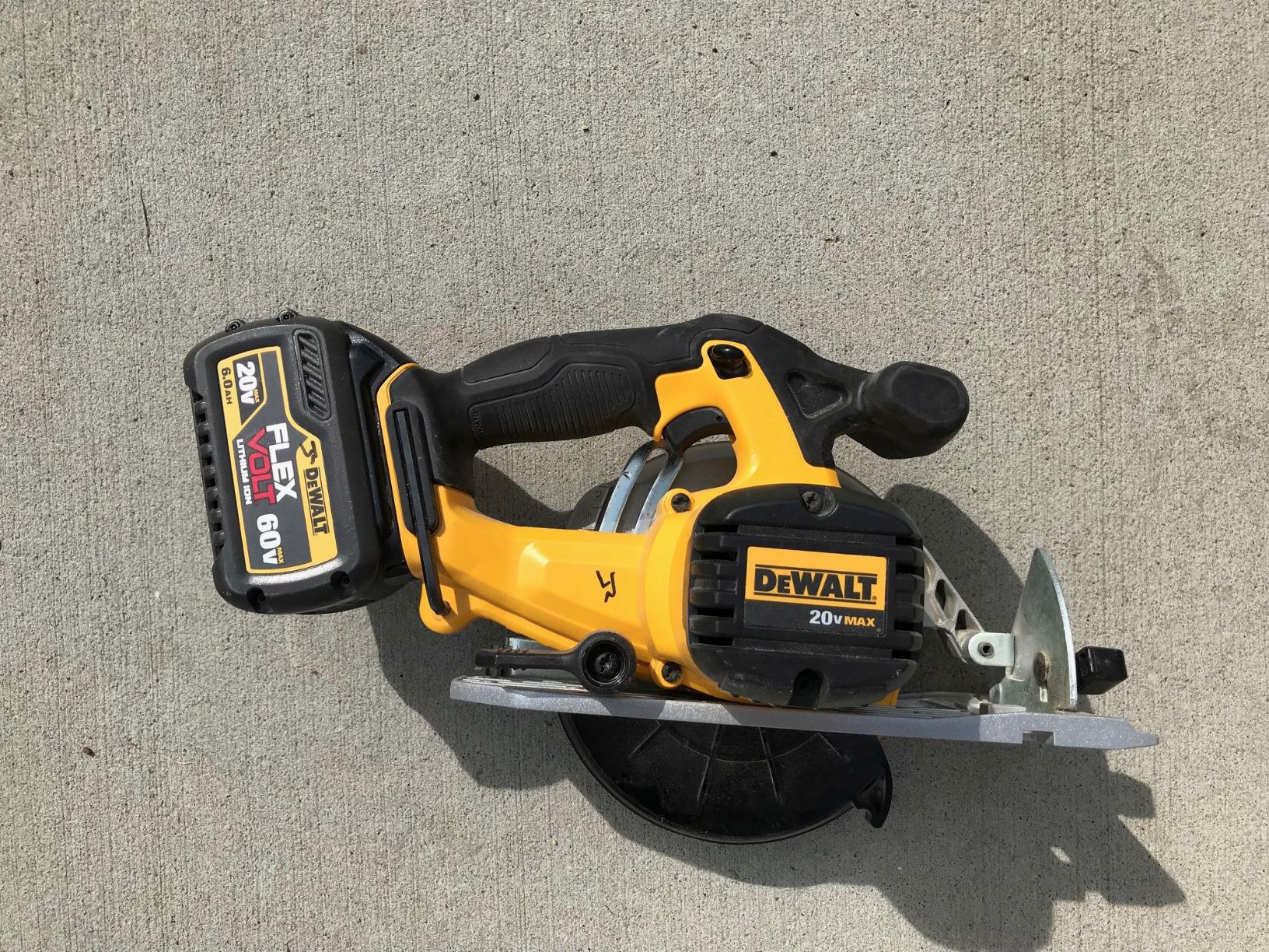 Close up of a DeWalt circular saw blade and lower guard mechanism
