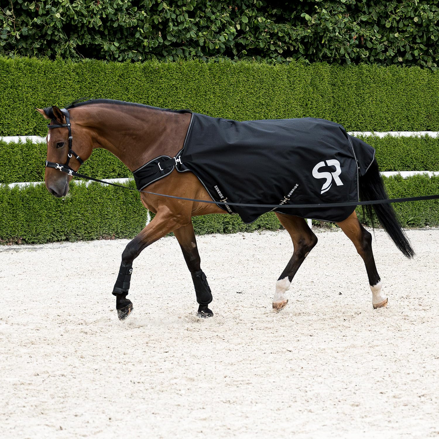 SUNRIDE Manta de Lluvia para Caballos 0g (Cornwell) - 100% Impermeable - 1200D - para Trabajo a la Cuerda y caminador de Caballos - Columna de Agua 3.000 mm - con Forro Polar (Negro,165 cm)