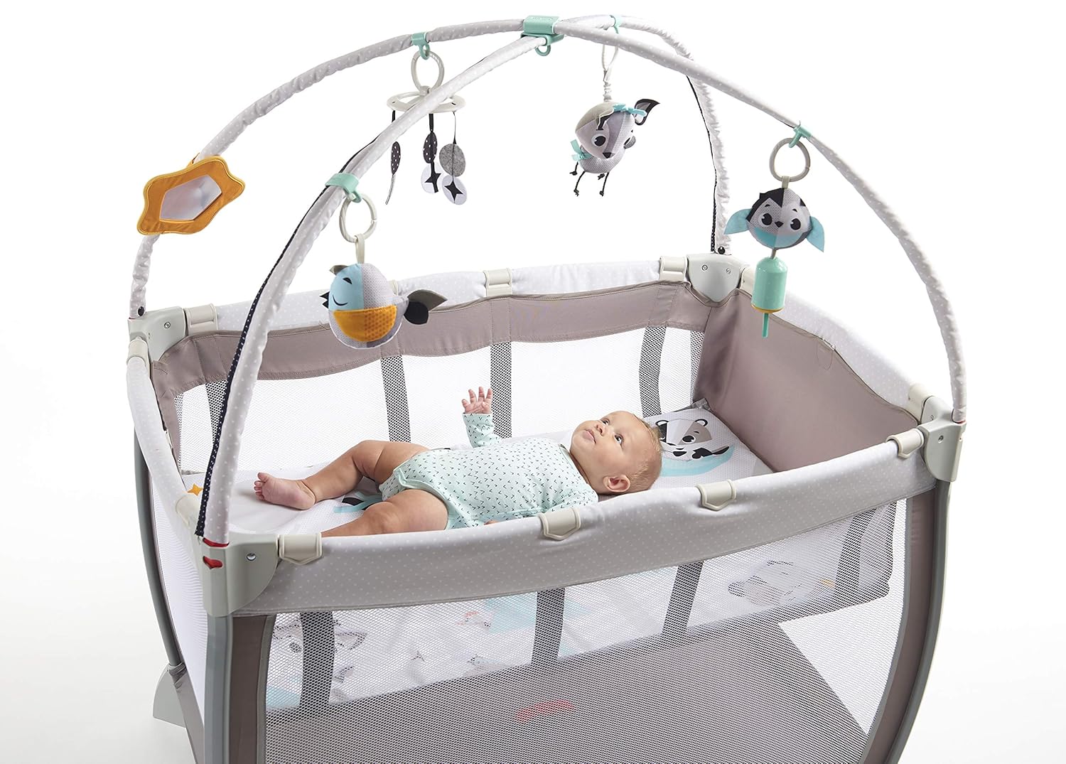 Image showing a person setting up the playard, locking the side rails.