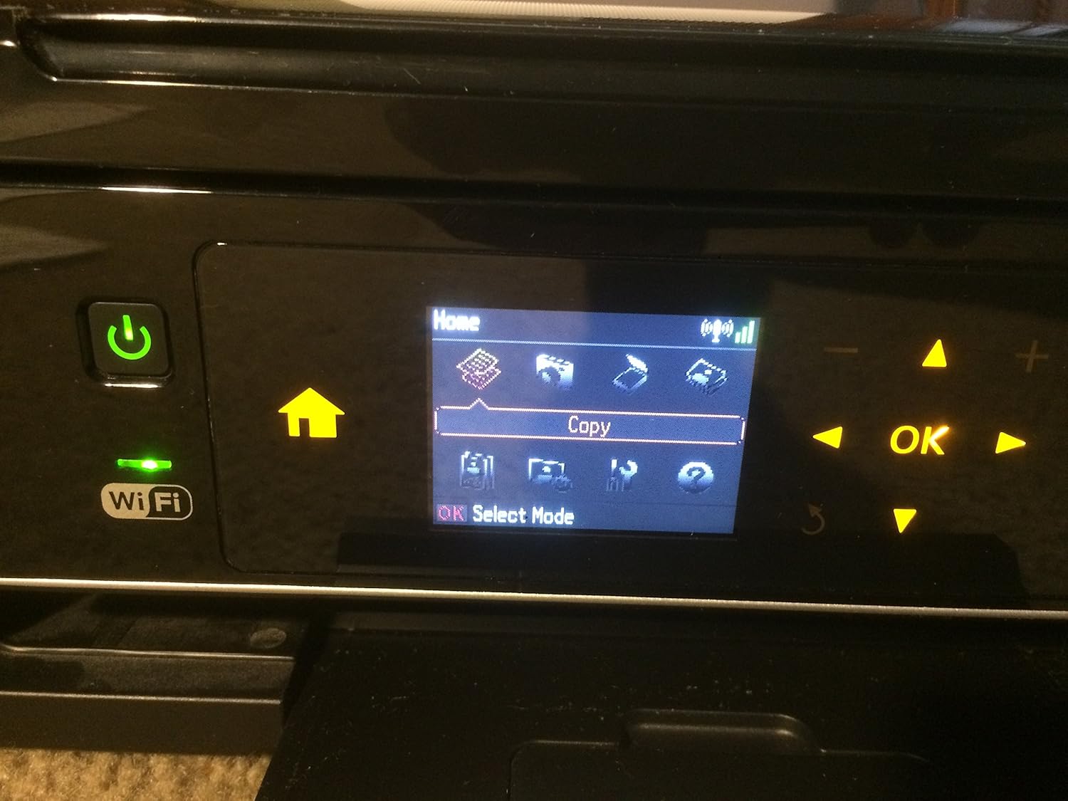Close-up of Epson Stylus NX430 control panel with LCD screen and buttons
