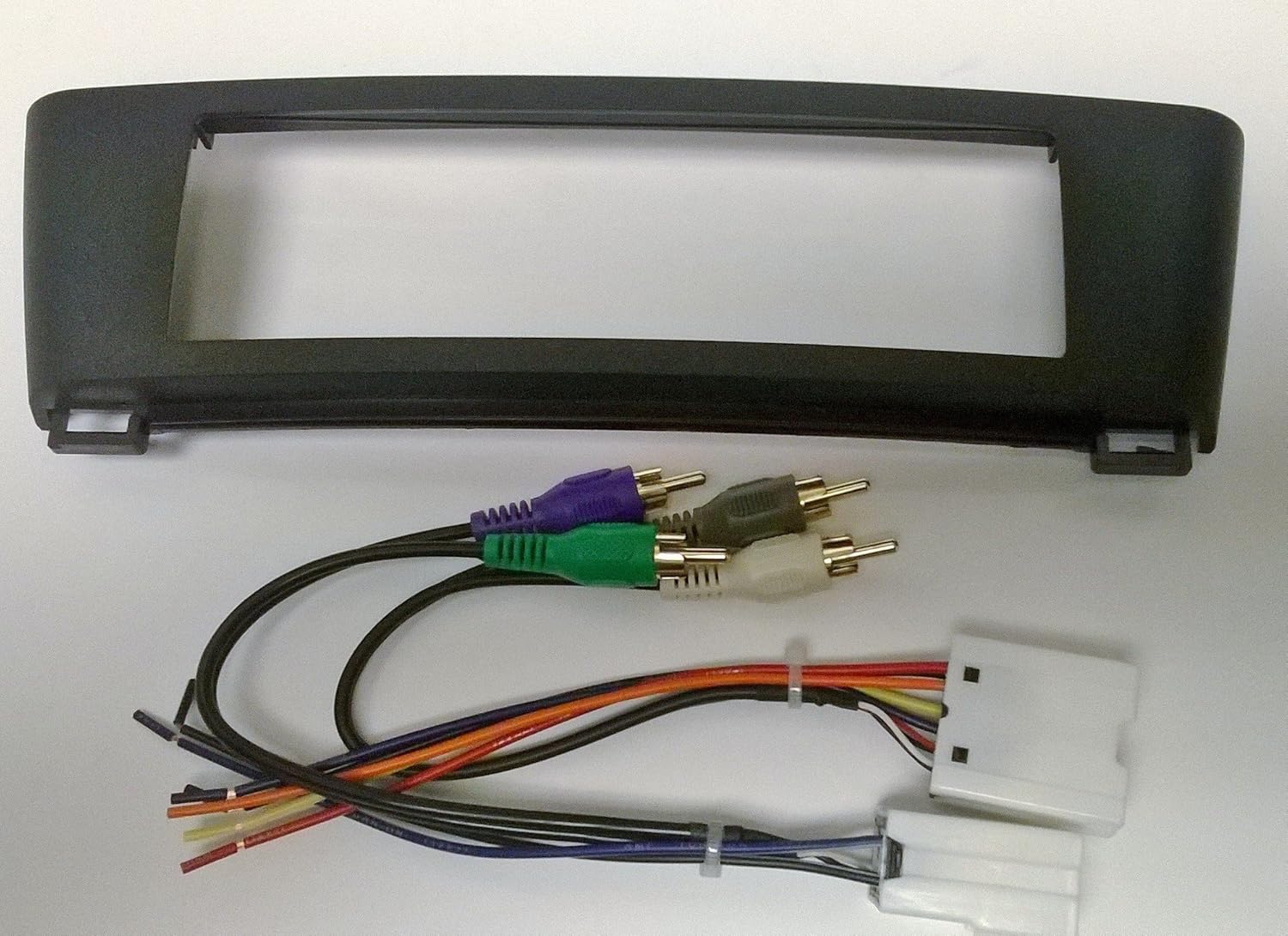 Stereo Dash Kit and Wire Harness for Installing a New Radio into a Nissan Sentra 2000-2006 (Factory Built in amp, Black with Smooth Gloss Texture)