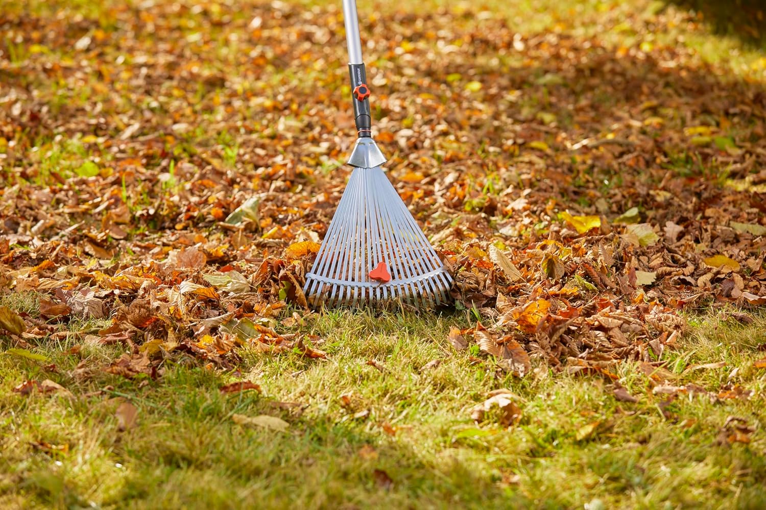 Gardena Combisystem Adjustable Rake Head with tines fully extended, ready for wide area raking.