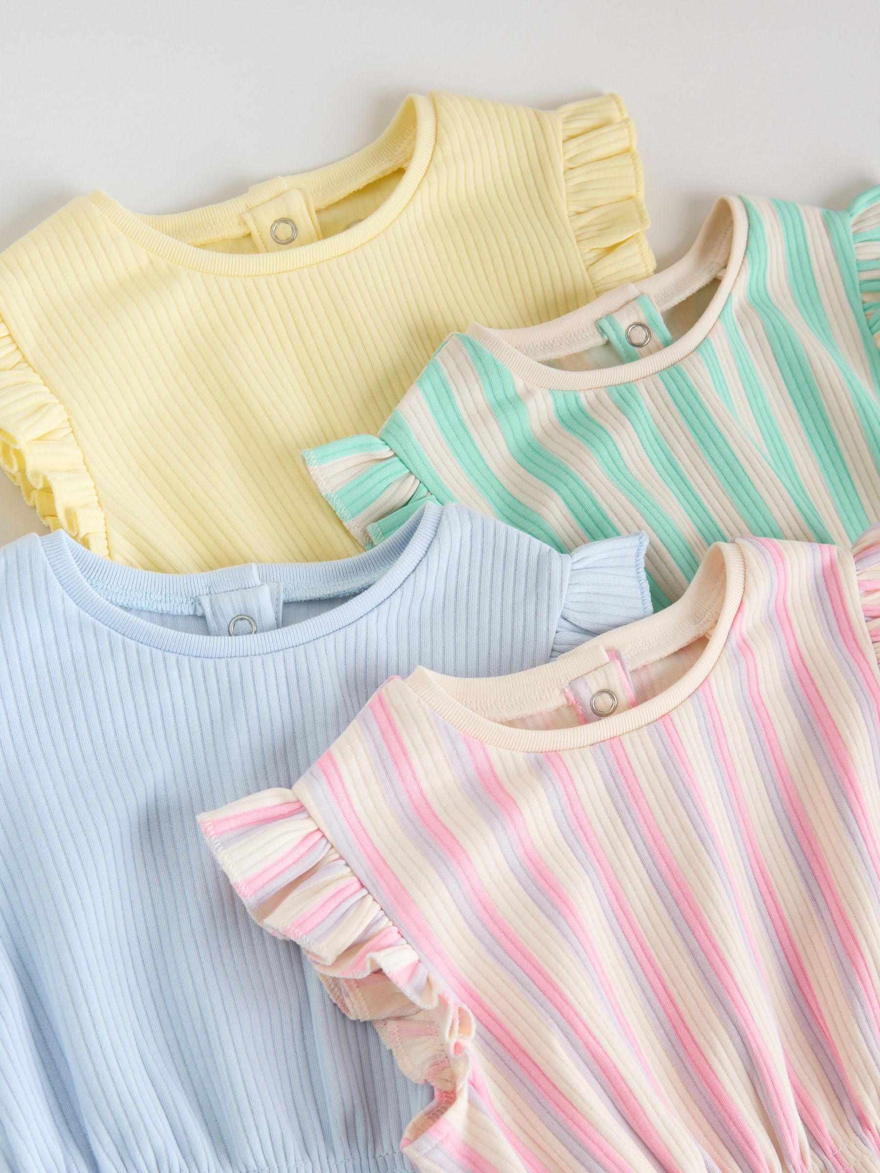 NEXT Bambina Confezione da 4 tutine per neonati con volant sulla spalla