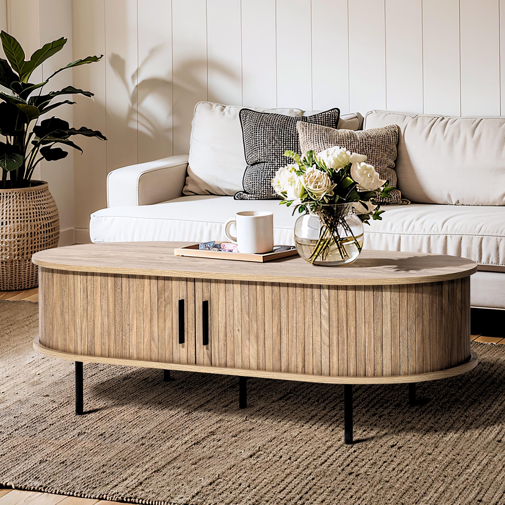 LuxenHome Oval Coffee Table with Storage, 47" Mid Century Modern Fluted Coffee Tables for Living Room, Wooden Sliding Door Boho Storage Center Table