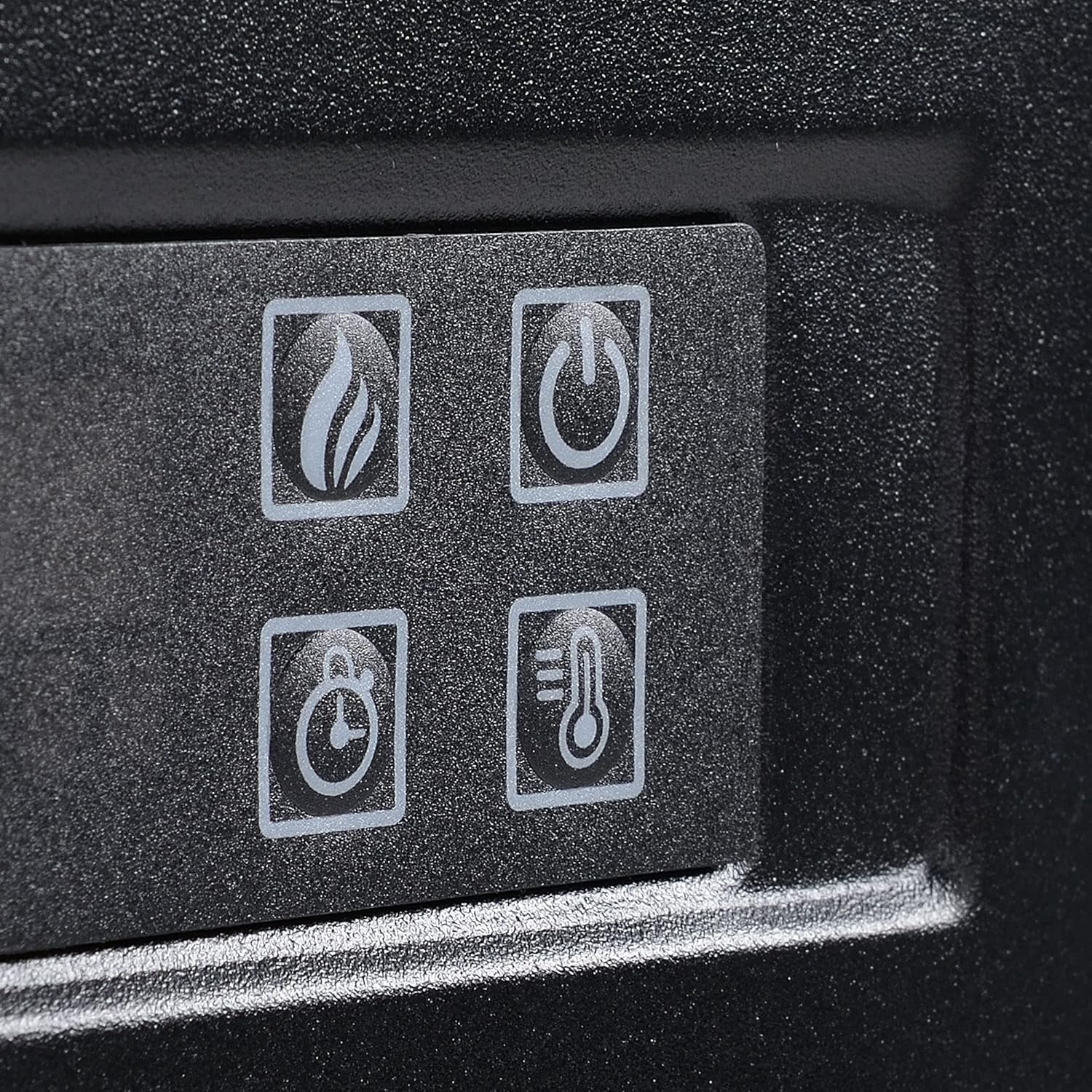 Close-up of the control panel buttons on the fireplace unit.