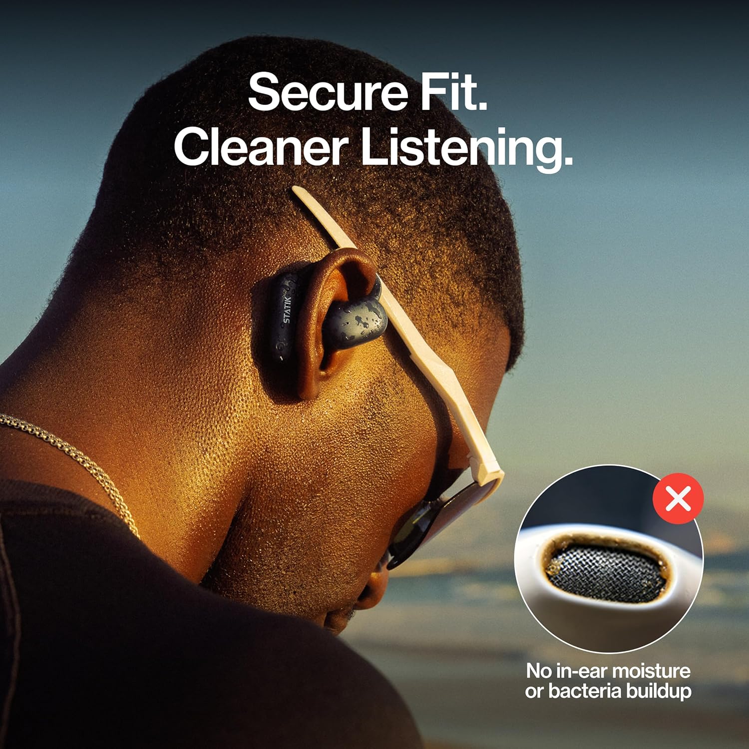 Person wearing Statik Aktive Open Ear Bluetooth Earbuds, demonstrating secure fit and open-ear design