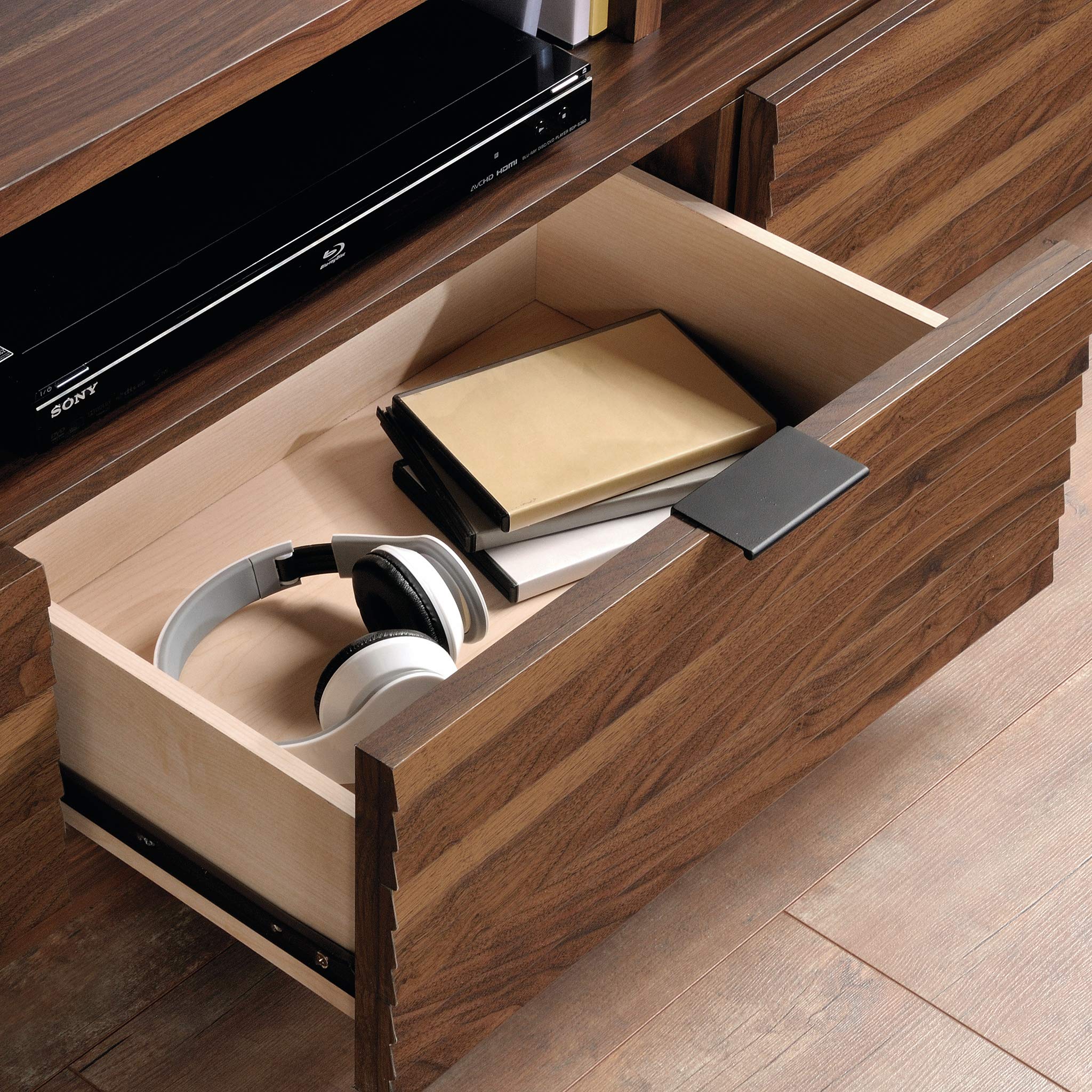 Open drawer of the Sauder Harvey Park Media Console showing storage space