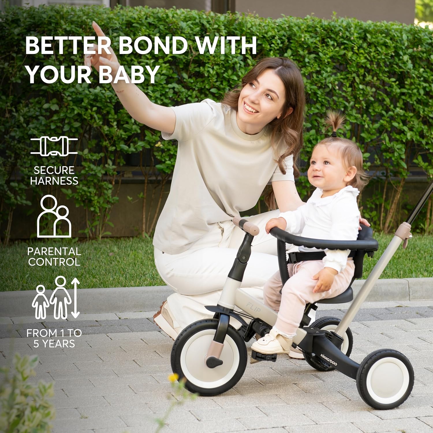 Image showing a parent with a child on the KikkaBoo FLIP tricycle, highlighting secure harness and parental control