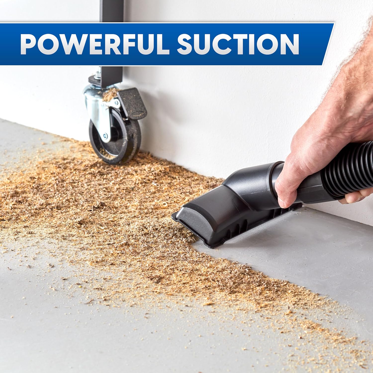 Person using Vacmaster wet/dry vacuum in blower mode outdoors.