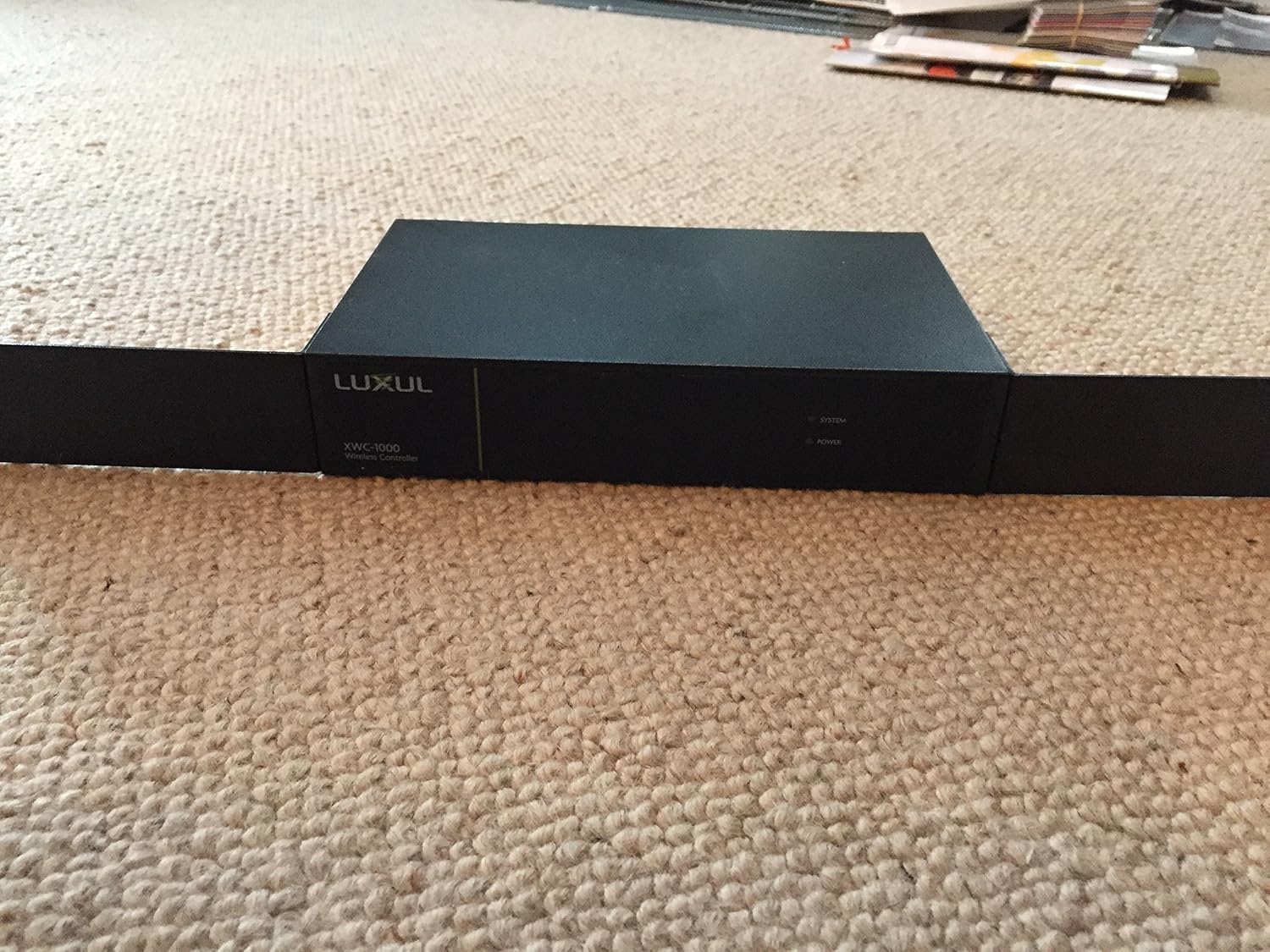 LUXUL XWC-1000 Wireless Controller product label with serial number and default login