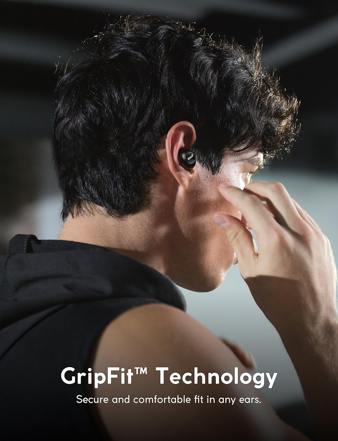 A person wearing Zolo Liberty+ earphones, demonstrating the secure GripFit™ technology during activity.