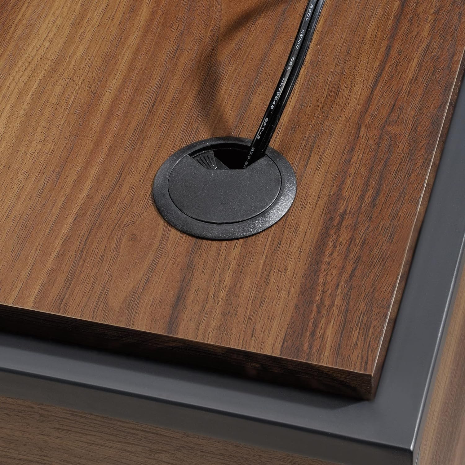 Close-up of a desktop cable grommet