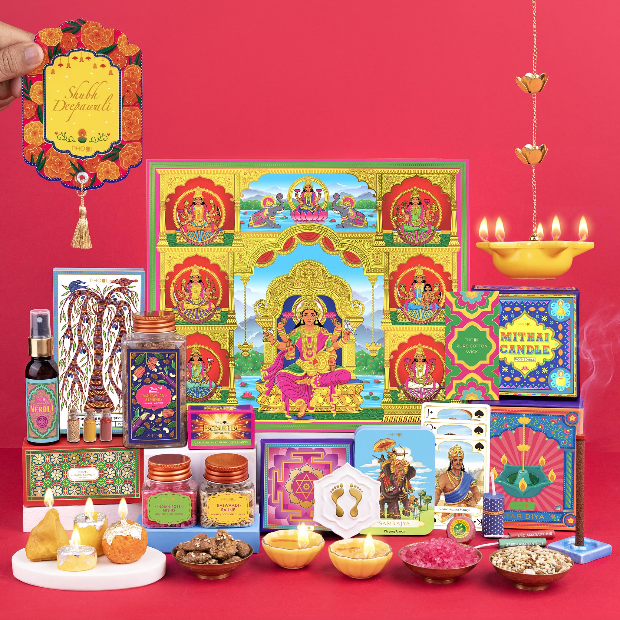 Phool Ashta Lakshmi Diwali Giftbox - 14 Item Gift Hamper - Contains Gold Lakshmi charan, Padma gold Yellow diya, Dry Fruit, Ceramic Wall hanging diya, Playing cards with Tin Box, Incense, rajwadi saunf and Mishri, Roli Chawal set (B0DFWJ1DT8) Amazon Price History, Amazon Price Tracker