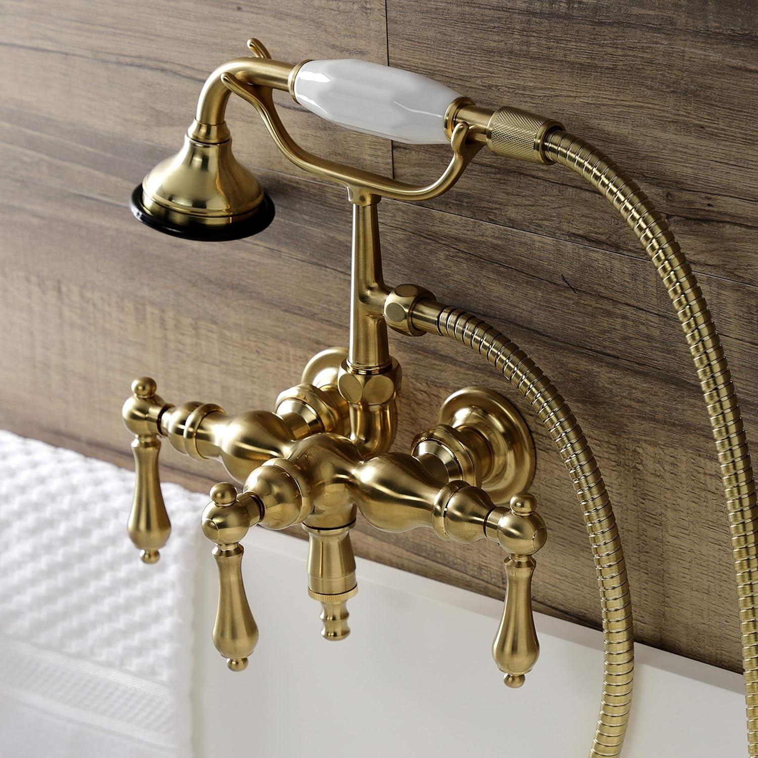 Kingston Brass AE19T7 Aqua Vintage 3-3/8 Inch Wall Mount Tub Faucet with Hand Shower, Brushed Brass