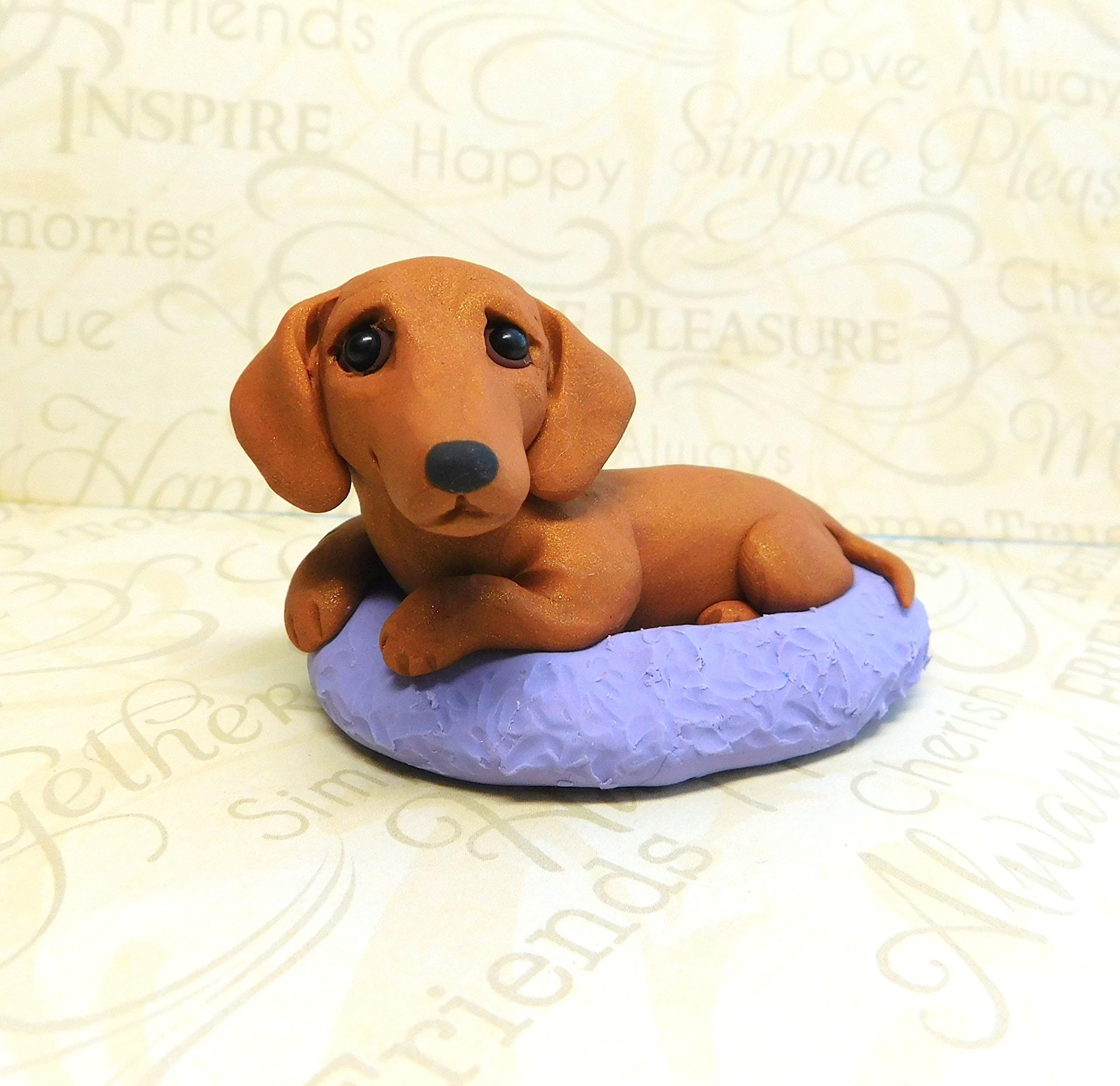 Dachshund in dog bed polymer clayn Doxie sculpture by Raquel at the WRC dog collectible